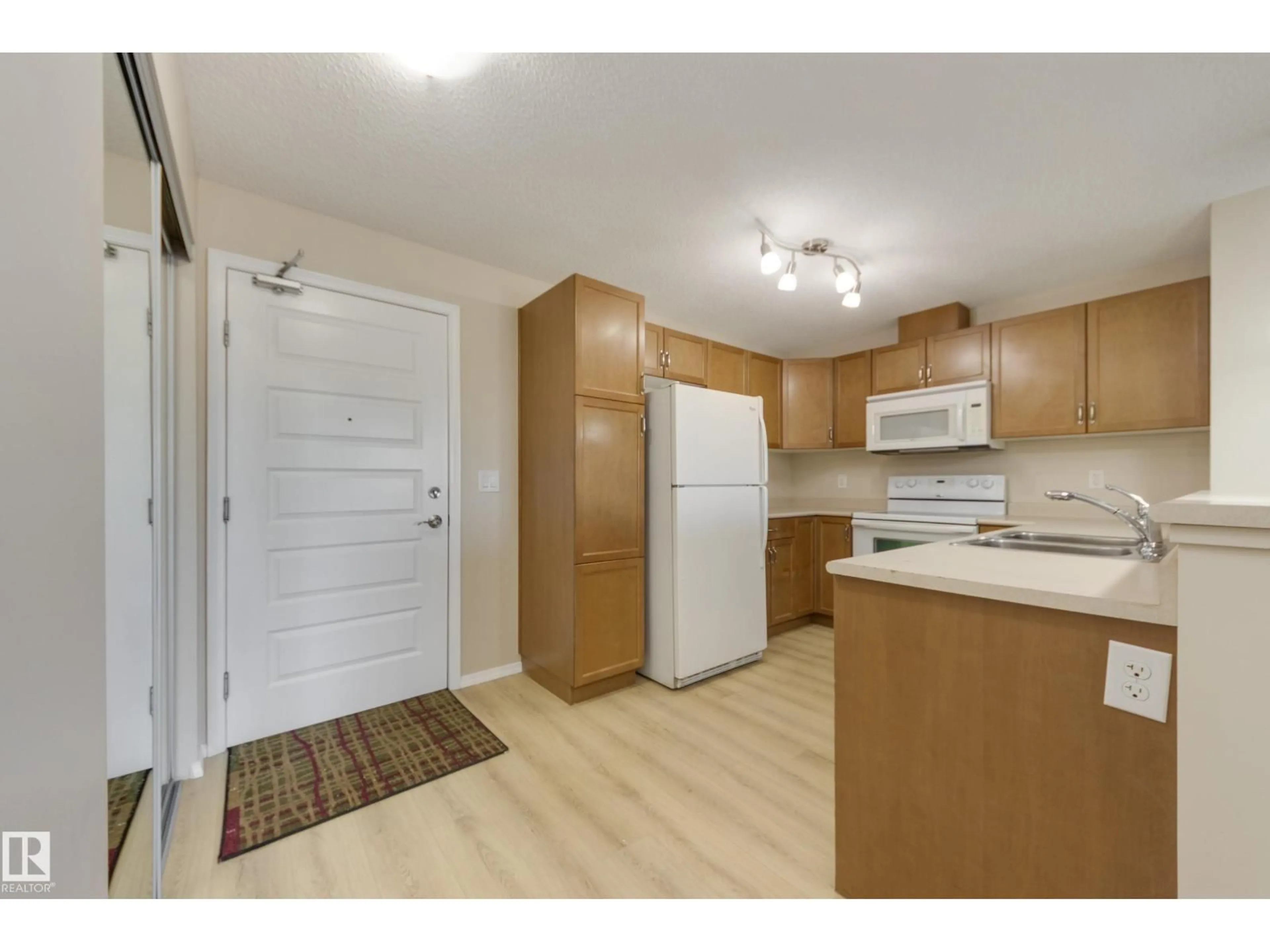 Standard kitchen, wood/laminate floor for #404 - 6070 SCHONSEE WY, Edmonton Alberta T5Z0G8