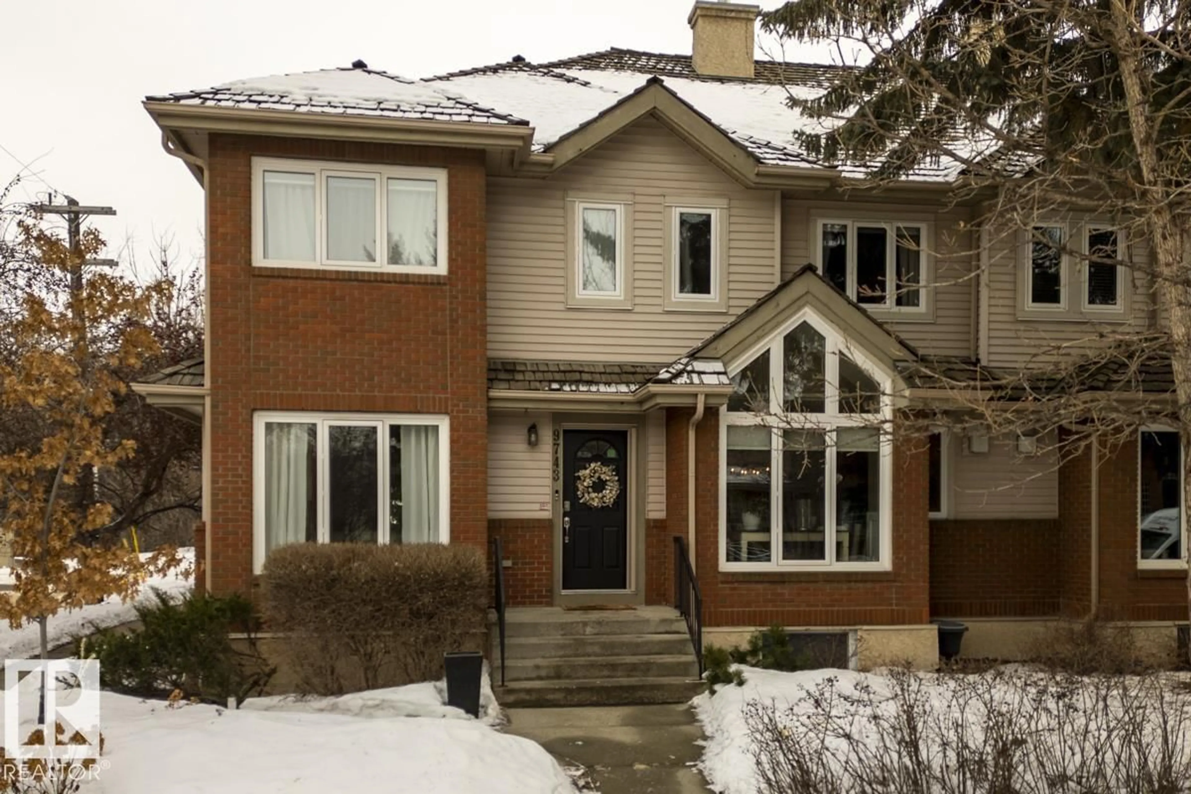 Home with brick exterior material, street for NW - 9743 91 ST, Edmonton Alberta T6C3P8