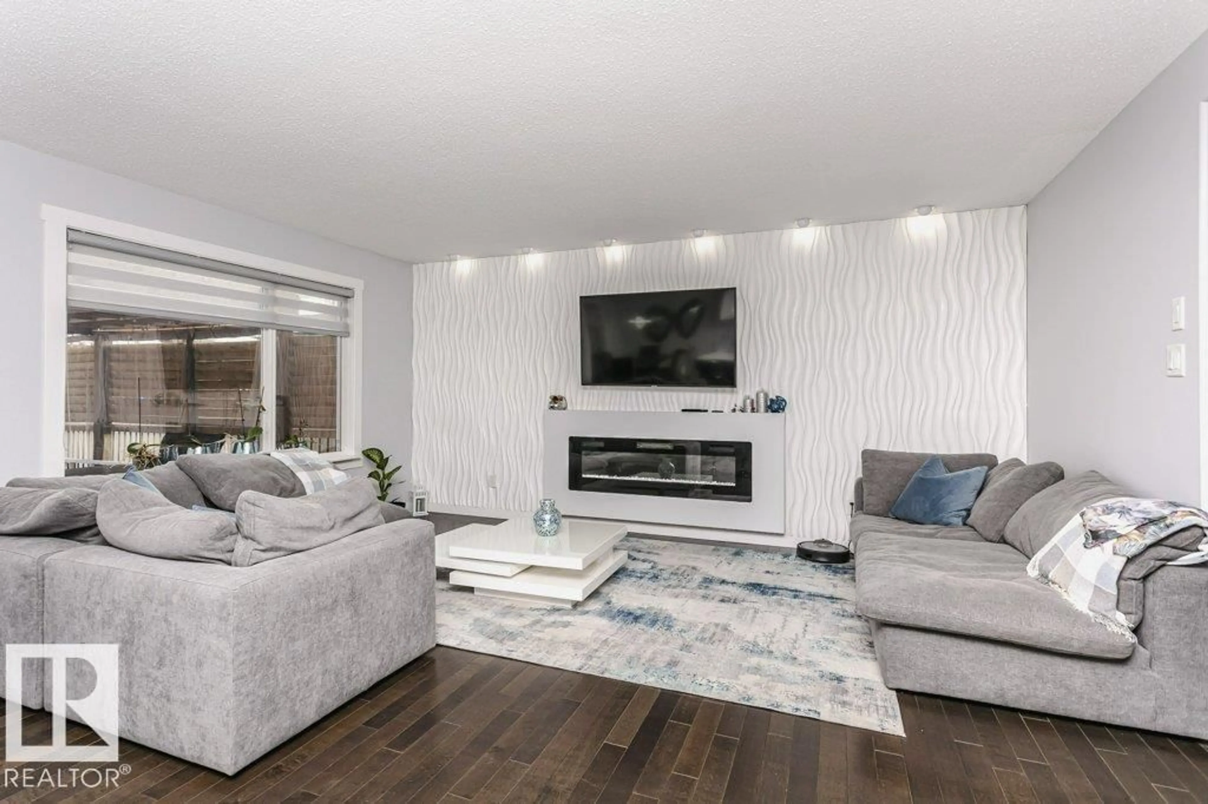 Living room with furniture, wood/laminate floor for 16109 137A ST, Edmonton Alberta T6V0E1