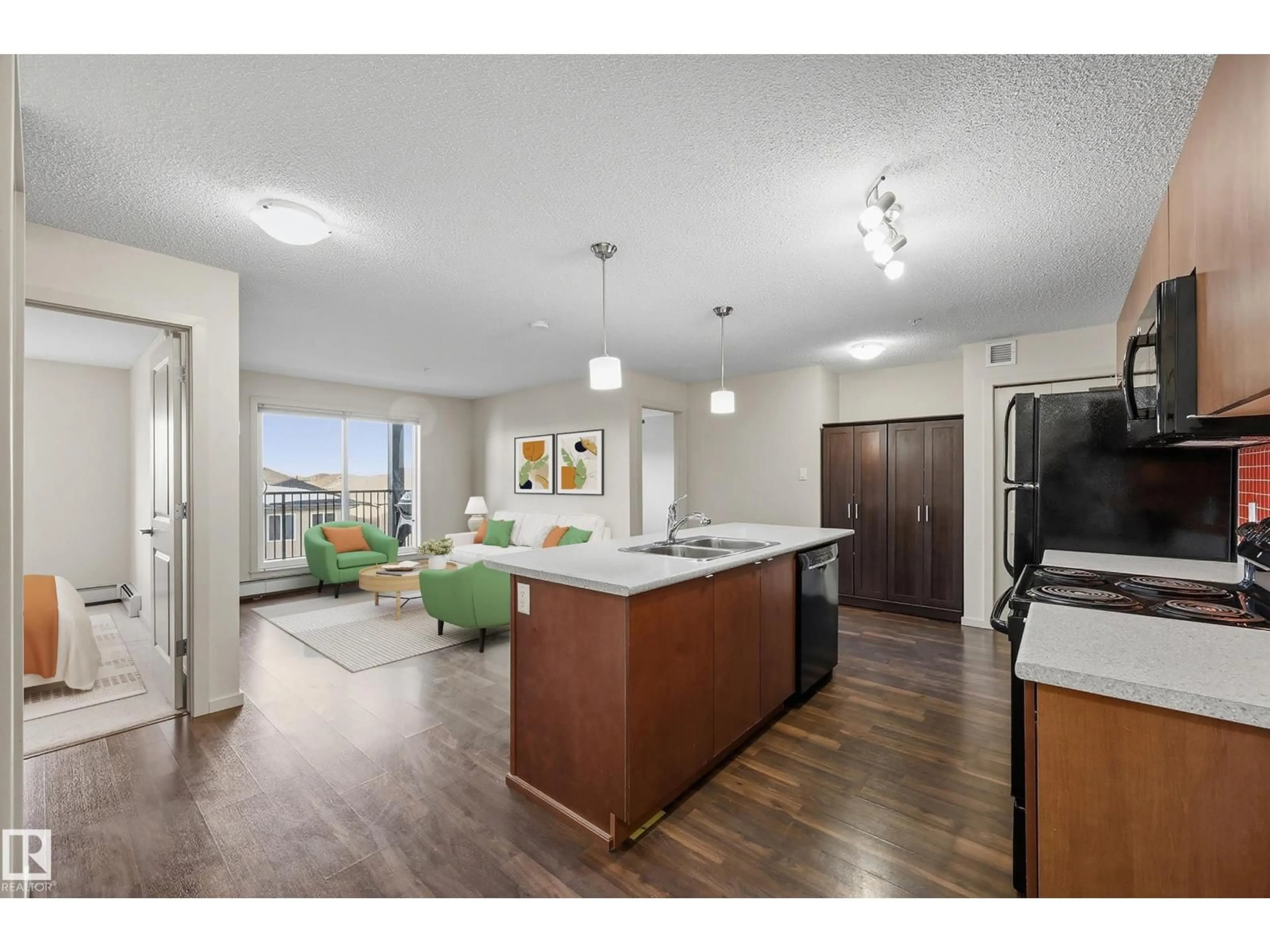 Open concept kitchen, wood/laminate floor for #309 - 508 ALBANY WY, Edmonton Alberta T6V0L1