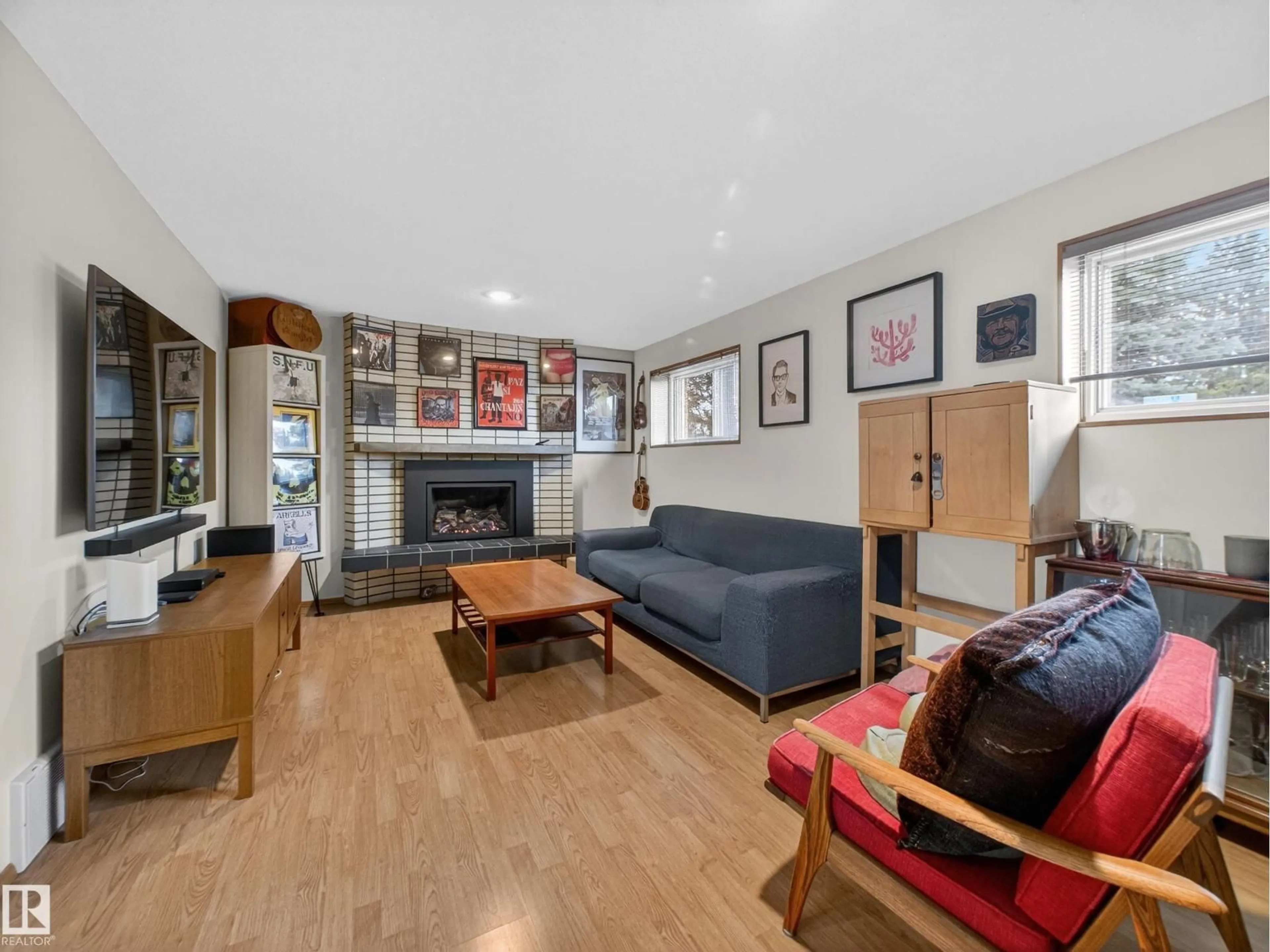 Living room with furniture, wood/laminate floor for 11008 40 AV, Edmonton Alberta T6J0P8