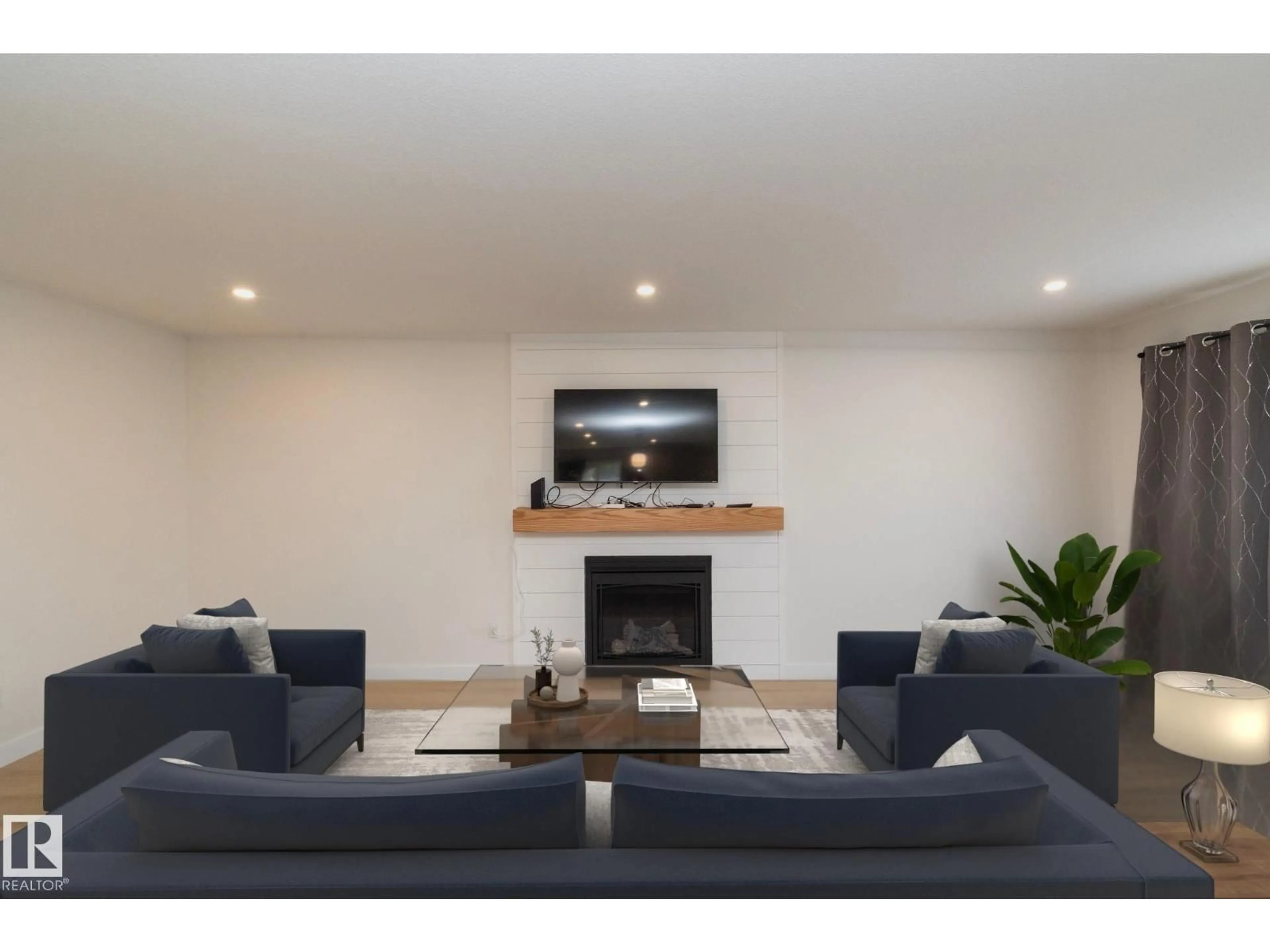 Living room with furniture, wood/laminate floor for 56 BRAZEAU DR, Devon Alberta T9G1M2