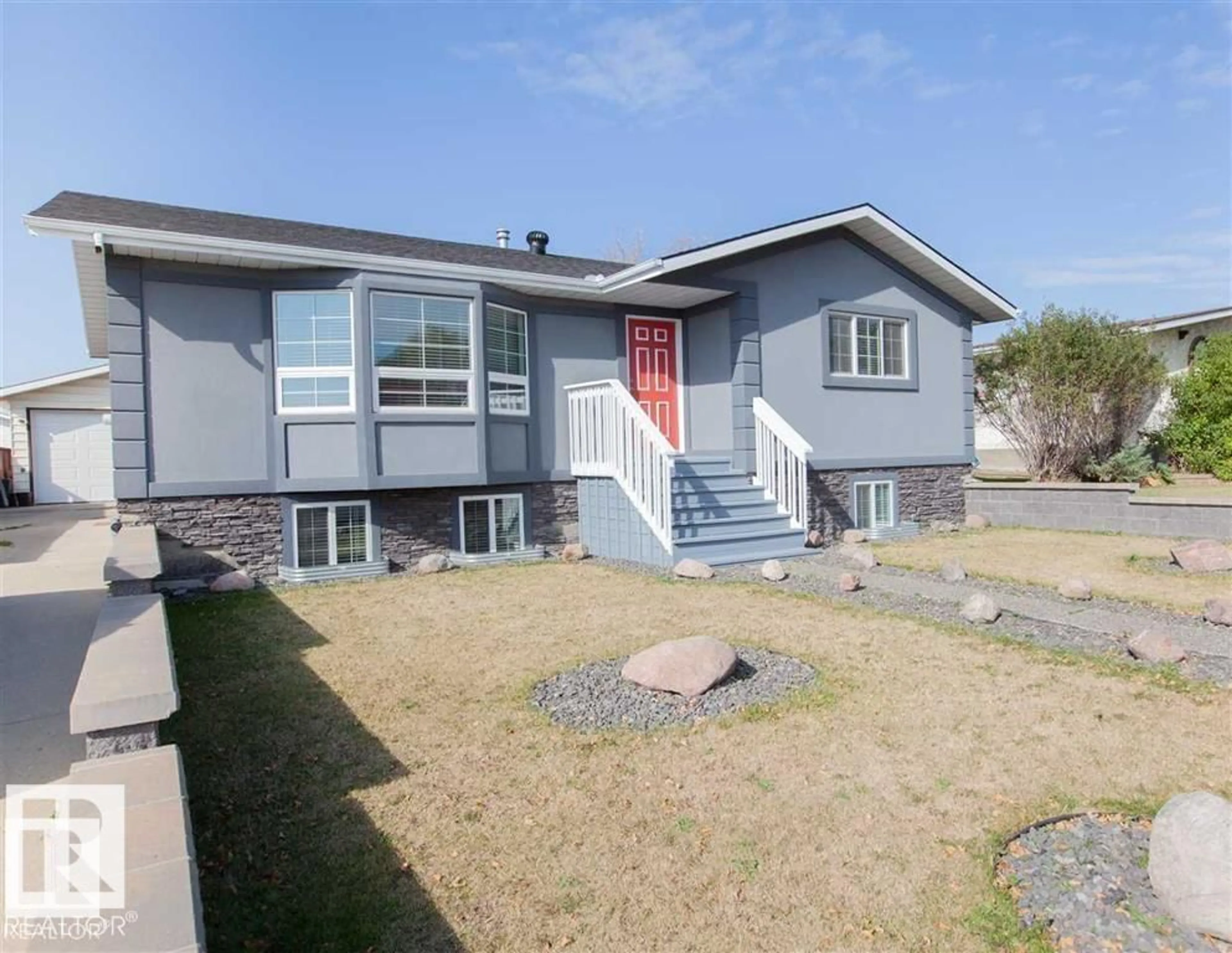 Home with vinyl exterior material, street for 17208 106 ST, Edmonton Alberta T5X3G8