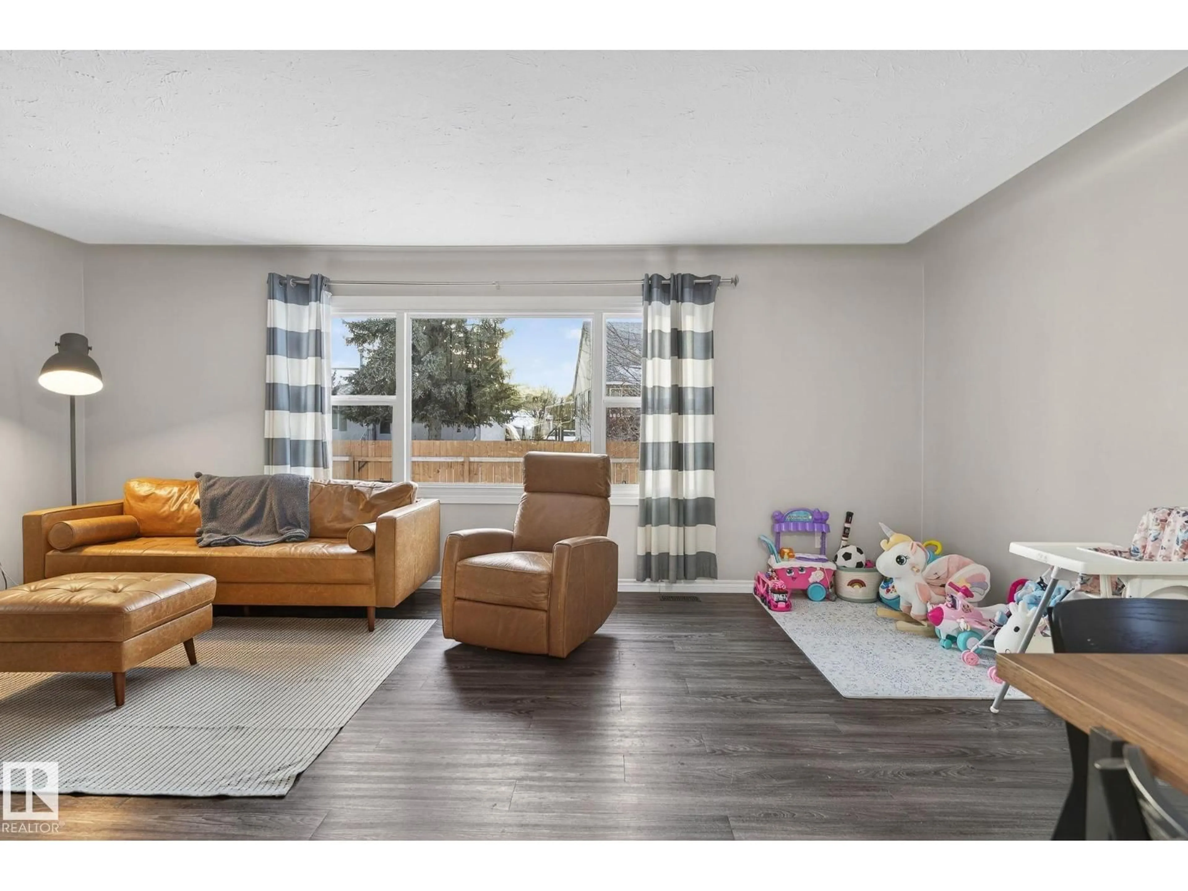 Living room with furniture, wood/laminate floor for 5 LANGLEY DR, Fort Saskatchewan Alberta T8L2L7