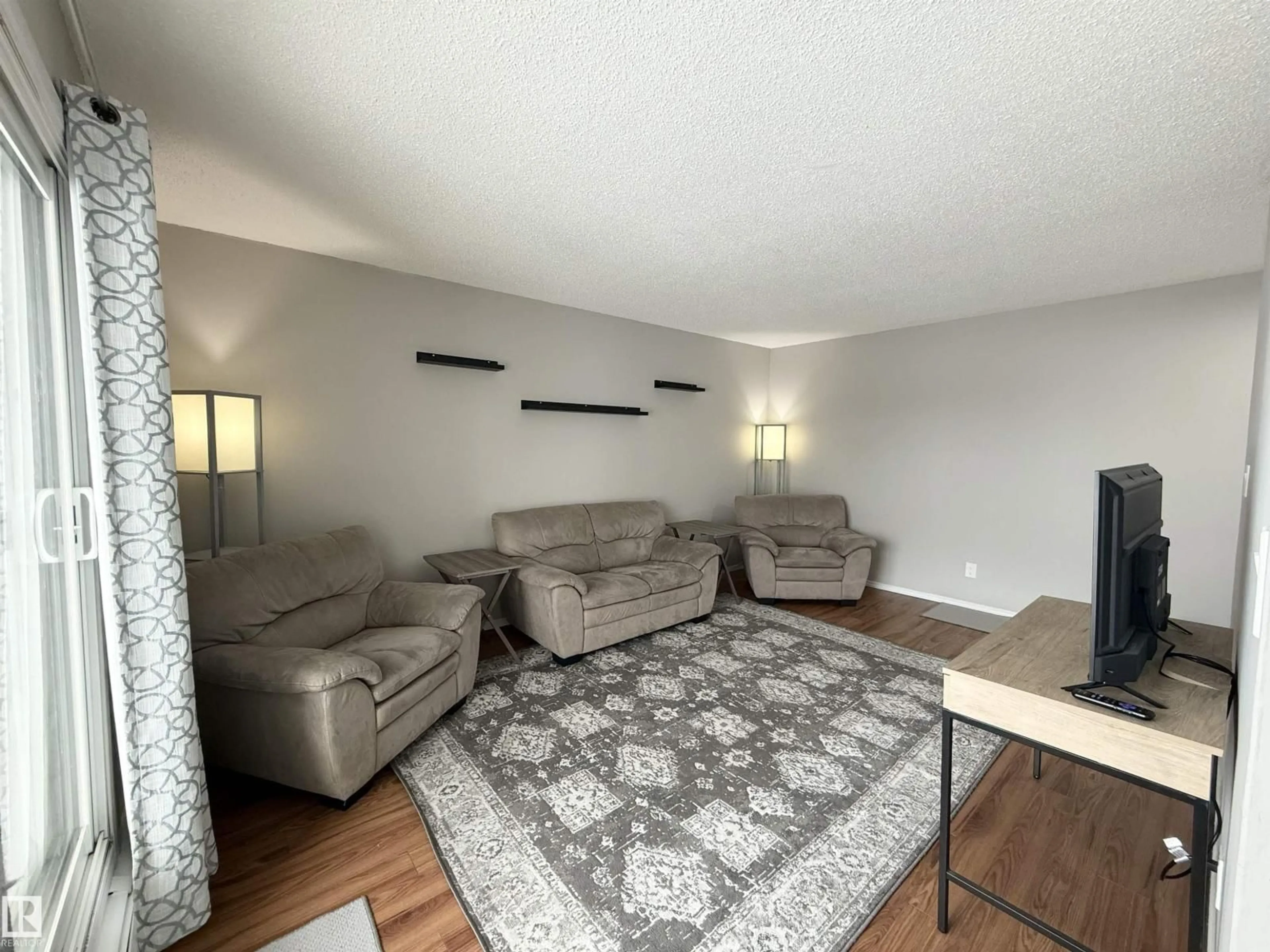 Living room with furniture, unknown for 44 11265 31 AV, Edmonton Alberta T6J3V7