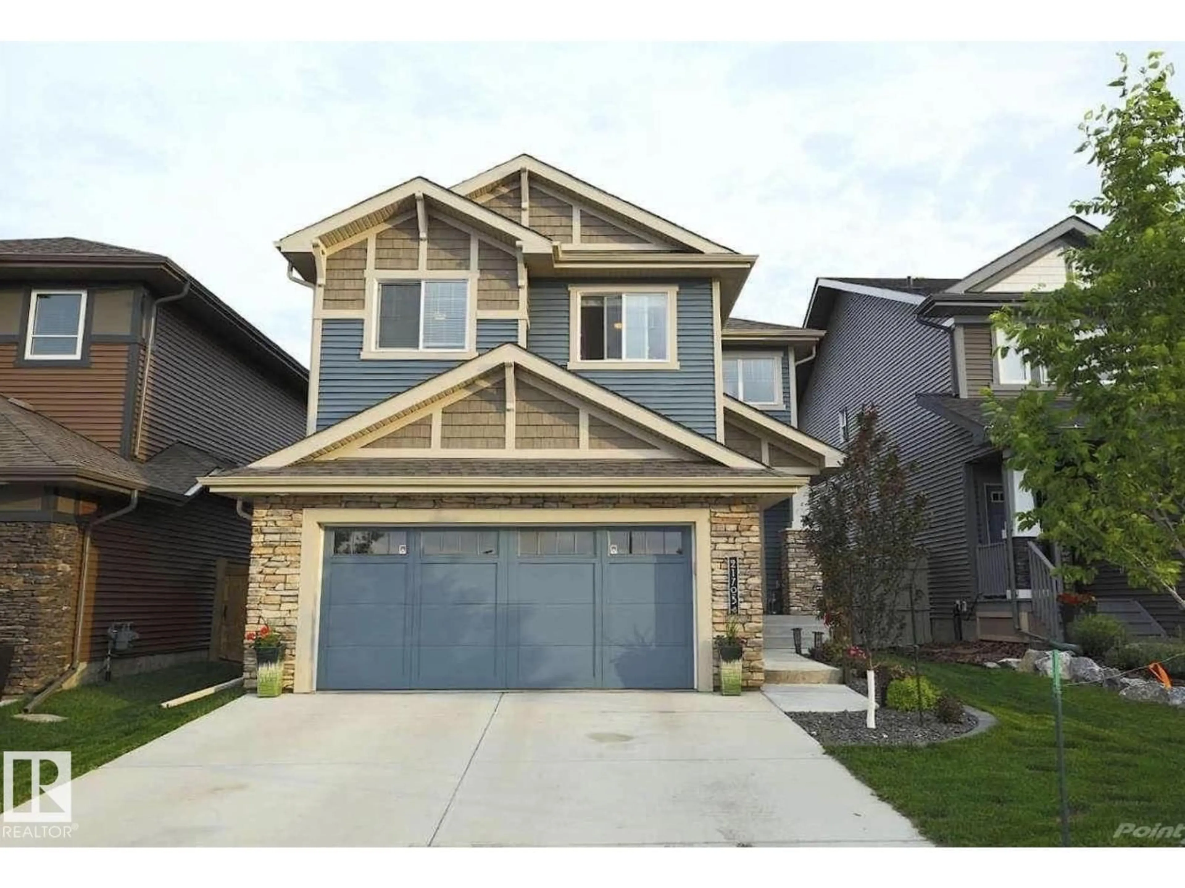 Home with vinyl exterior material, street for 21703 86 AVENUE AVENUE, Edmonton Alberta T5T4R9