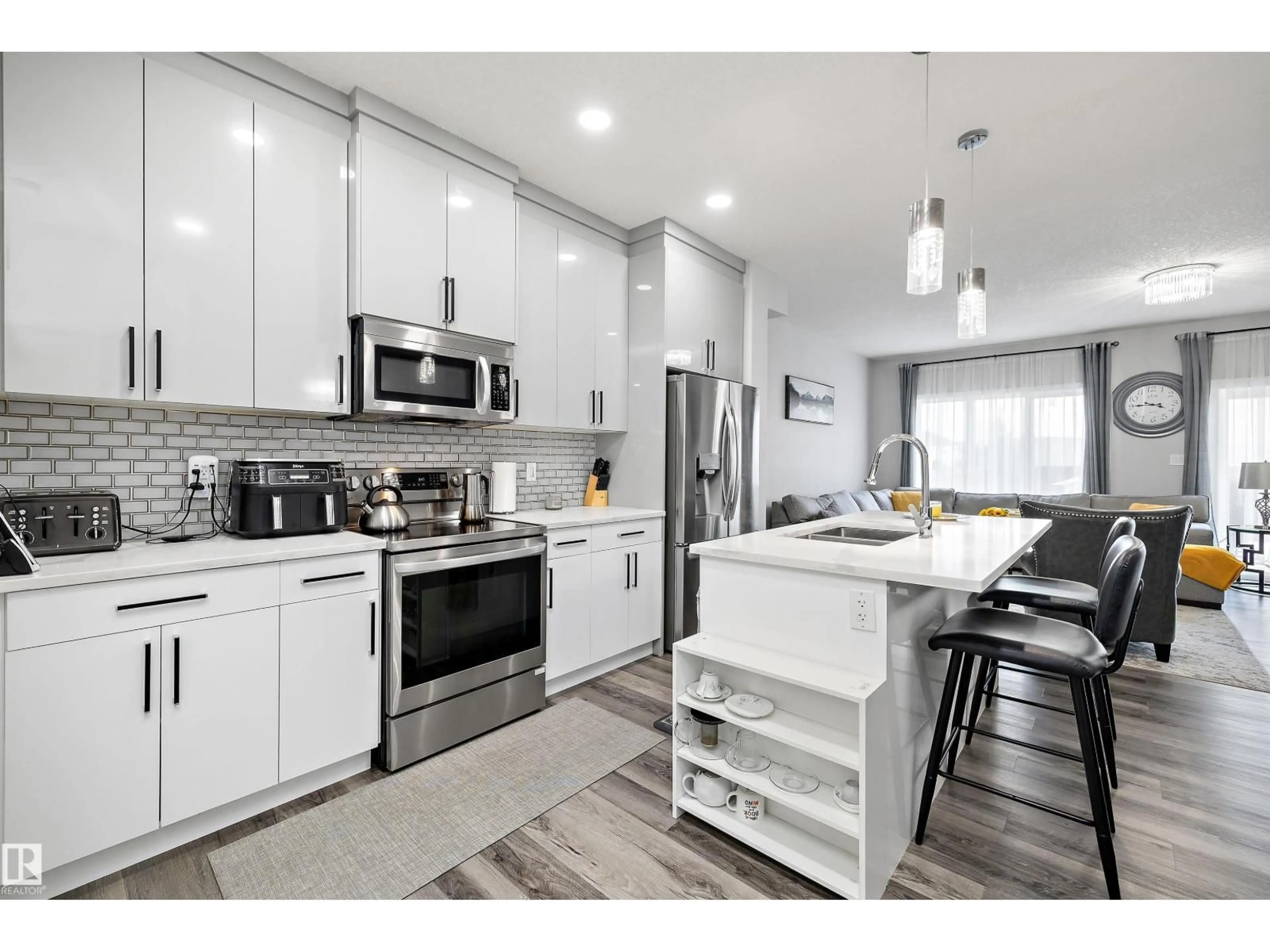Open concept kitchen, wood/laminate floor for NW - 6506 167A AV, Edmonton Alberta T5Y3P7