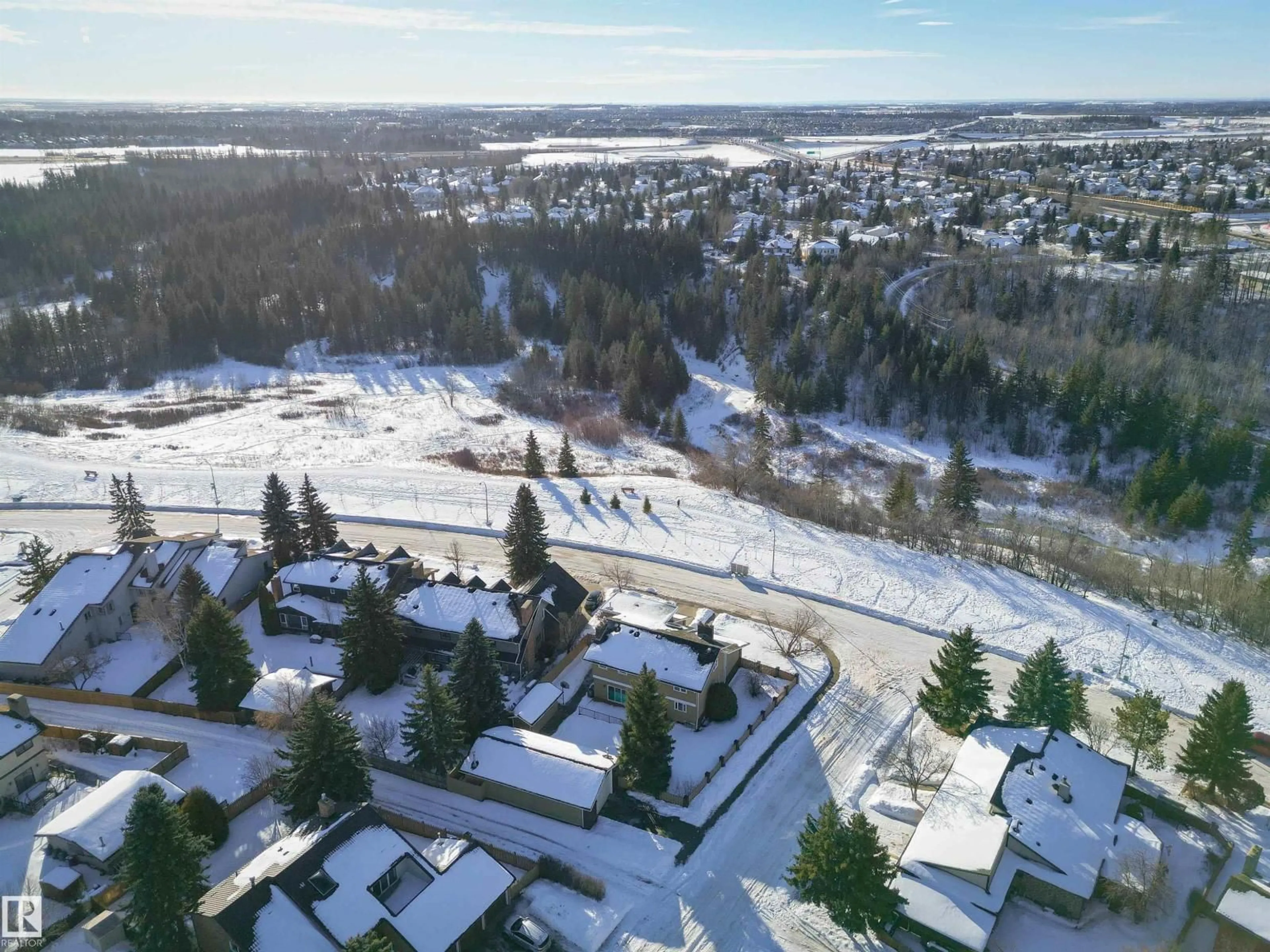 A pic from outside/outdoor area/front of a property/back of a property/a pic from drone, mountain view for 1407 BEARSPAW DR, Edmonton Alberta T6J5B2