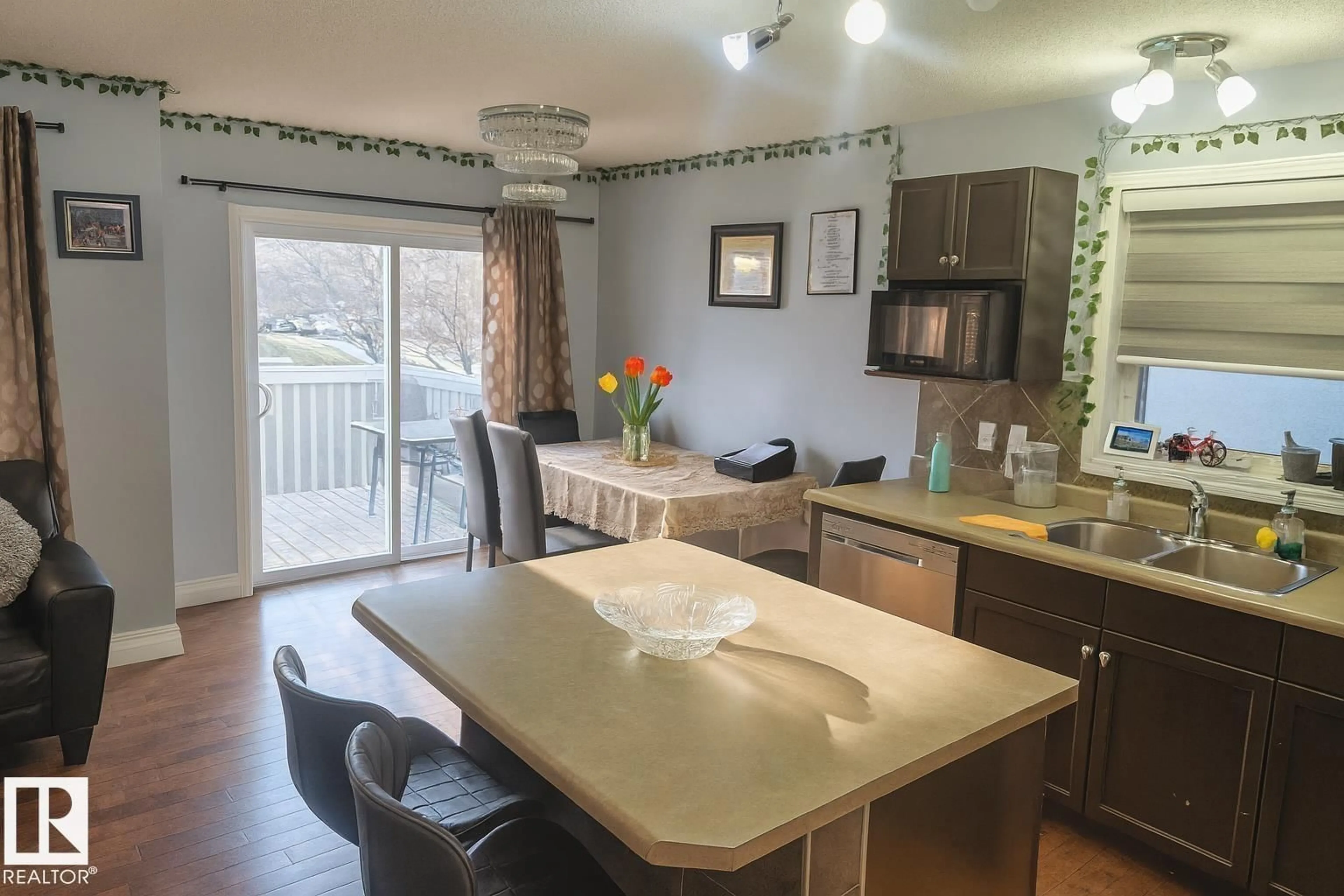 Open concept kitchen, wood/laminate floor for #4 - 4350 23 ST, Edmonton Alberta T6T1X8