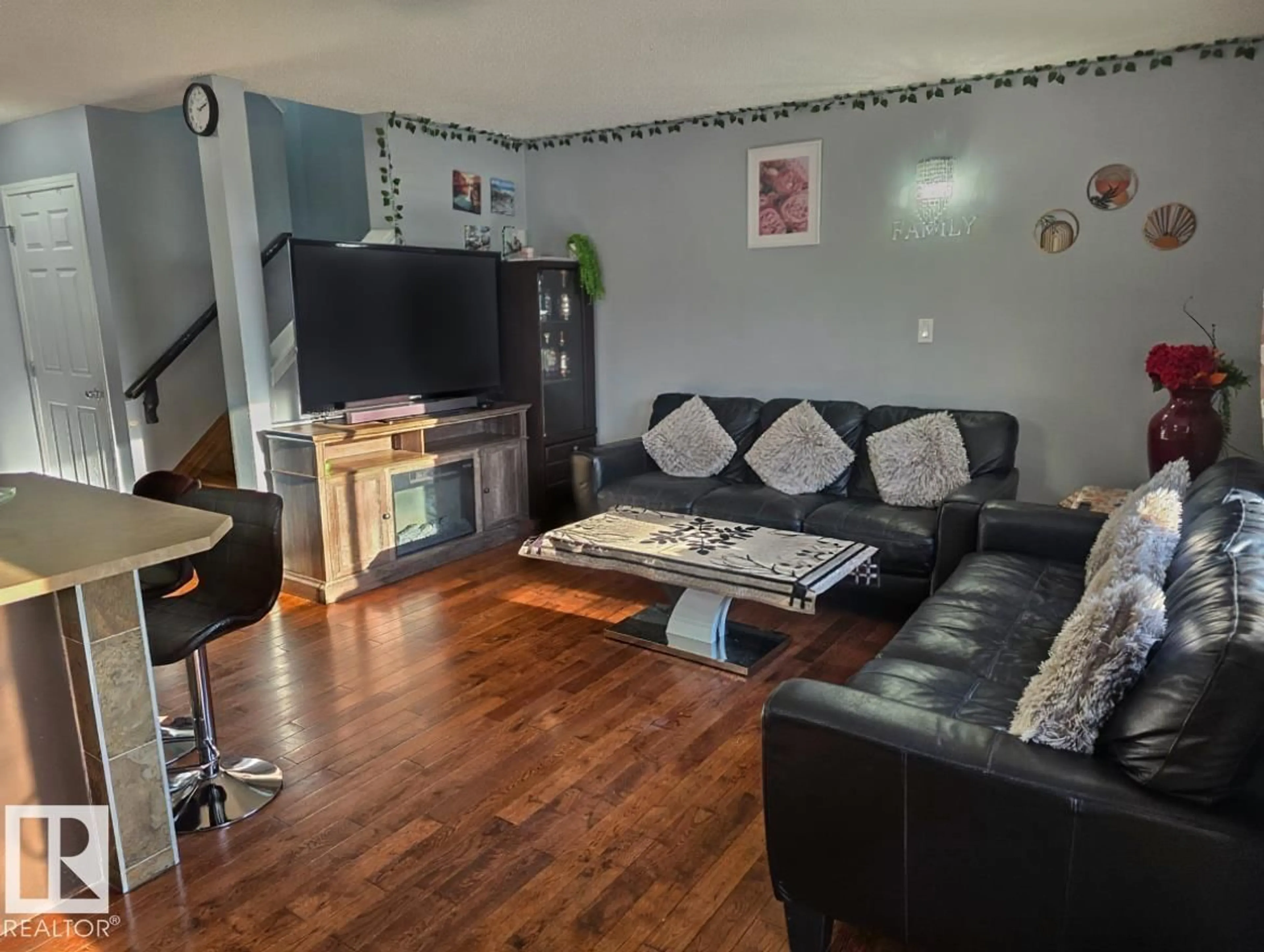 Living room with furniture, wood/laminate floor for #4 - 4350 23 ST, Edmonton Alberta T6T1X8
