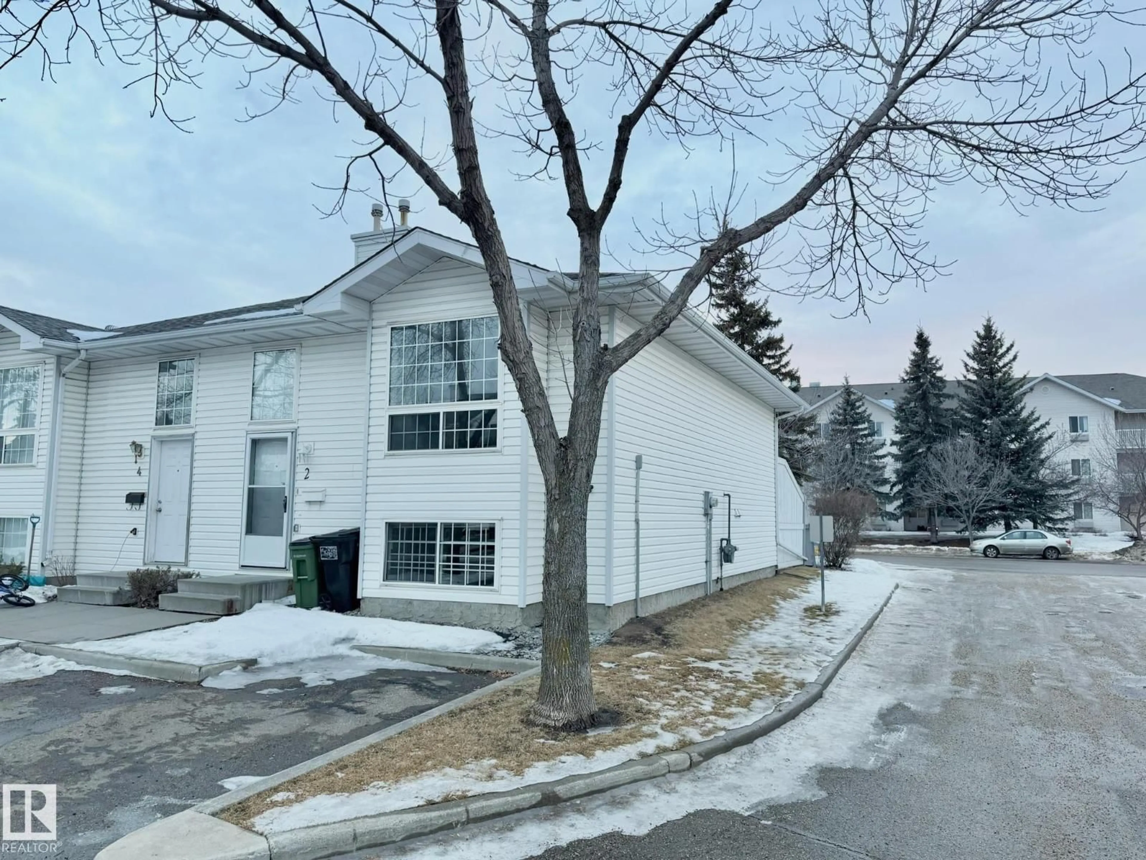 A pic from outside/outdoor area/front of a property/back of a property/a pic from drone, street for #2 - 3311 58 ST, Edmonton Alberta T6L6X3
