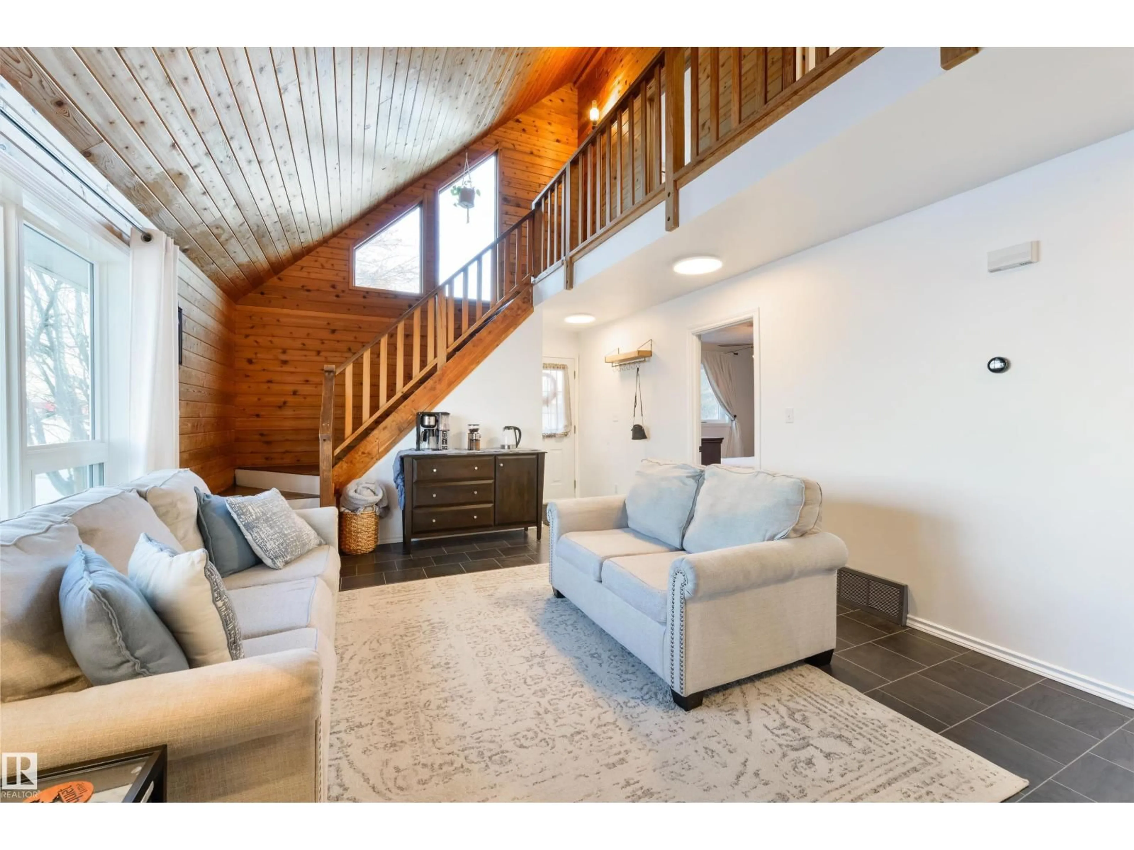 Living room with furniture, wood/laminate floor for 5113 47 AV, Legal Alberta T0G1L0