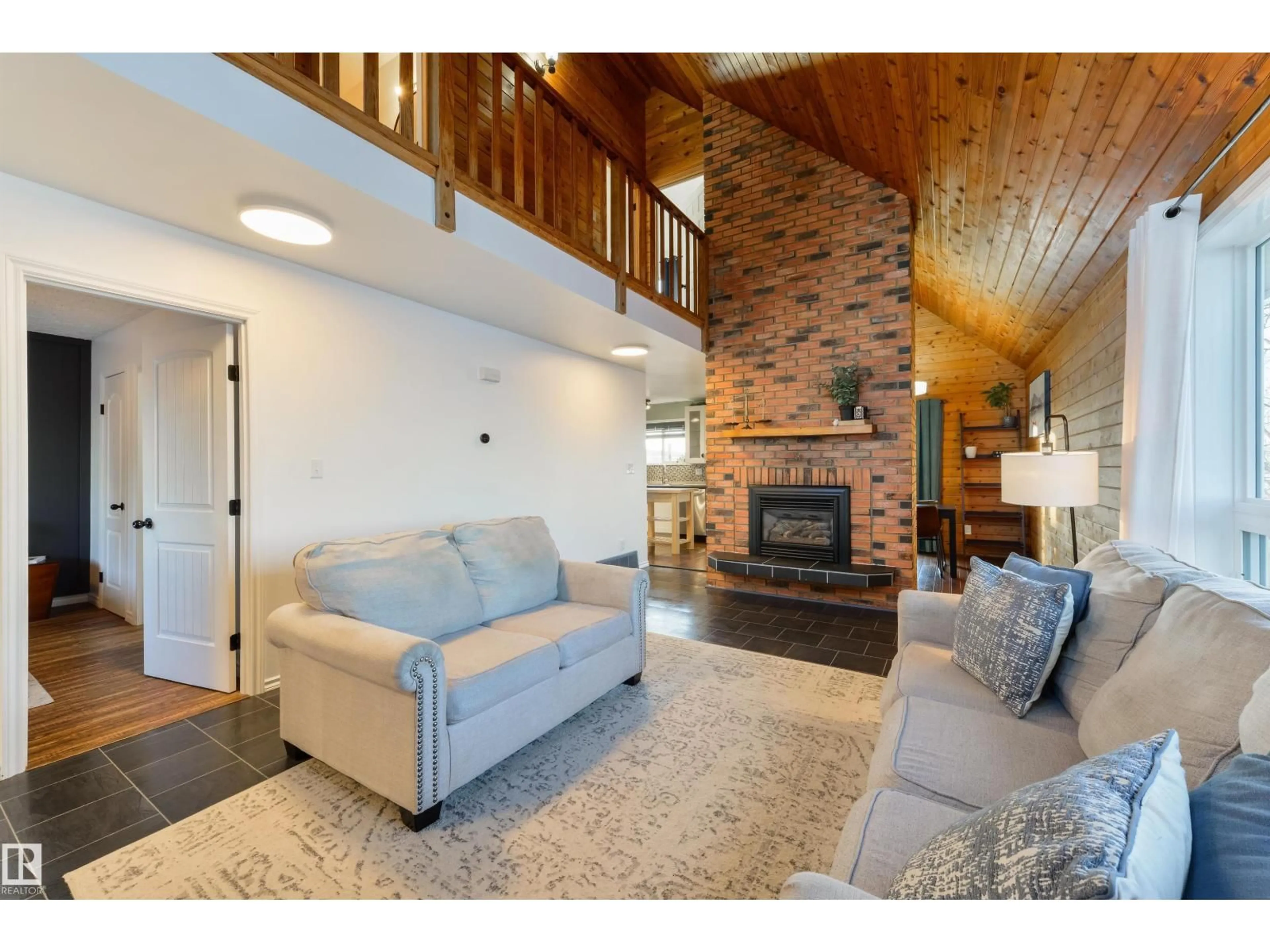 Living room with furniture, wood/laminate floor for 5113 47 AV, Legal Alberta T0G1L0