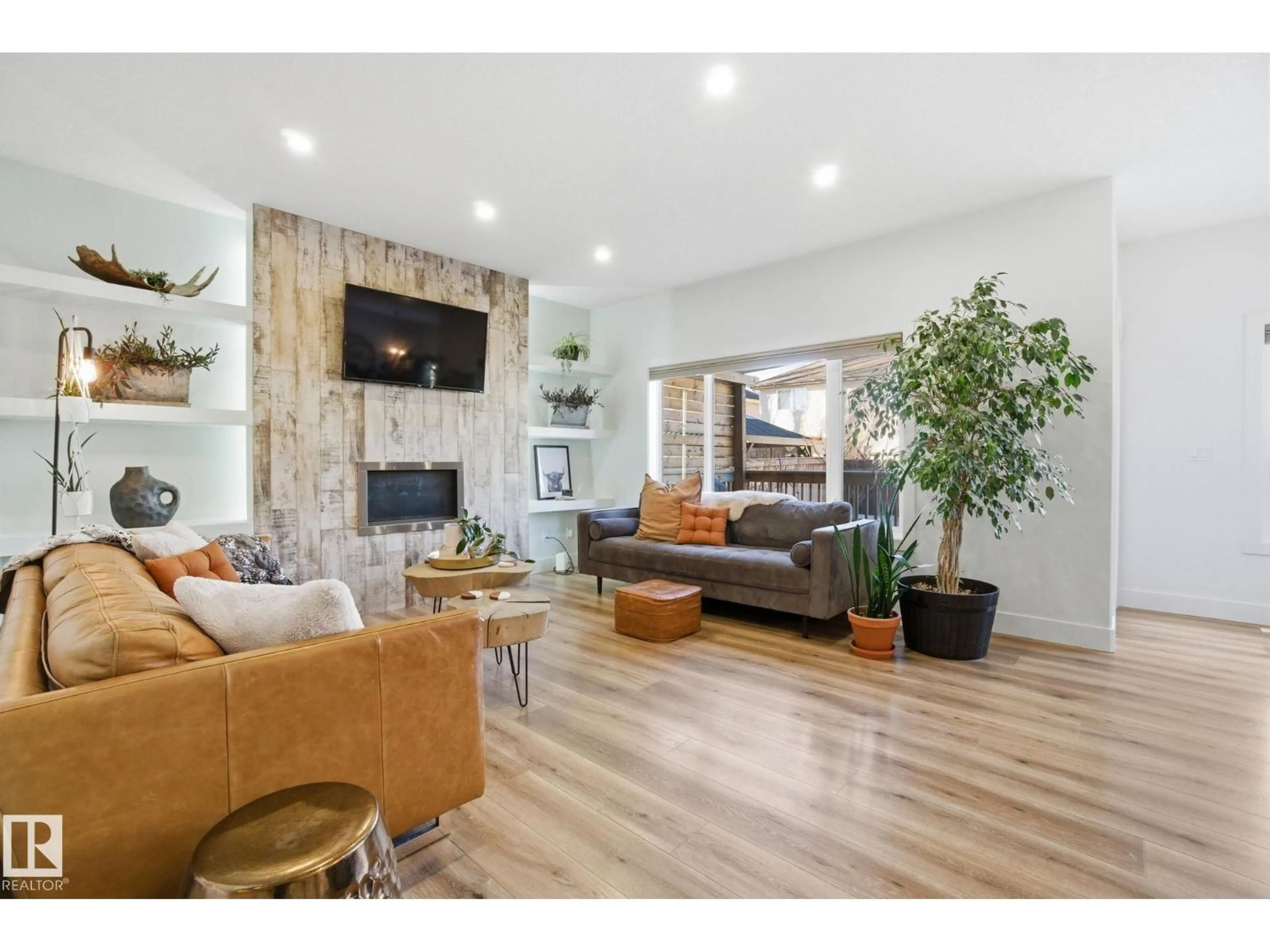 Living room with furniture, wood/laminate floor for 8712 96A AV, Morinville Alberta T8R2N9