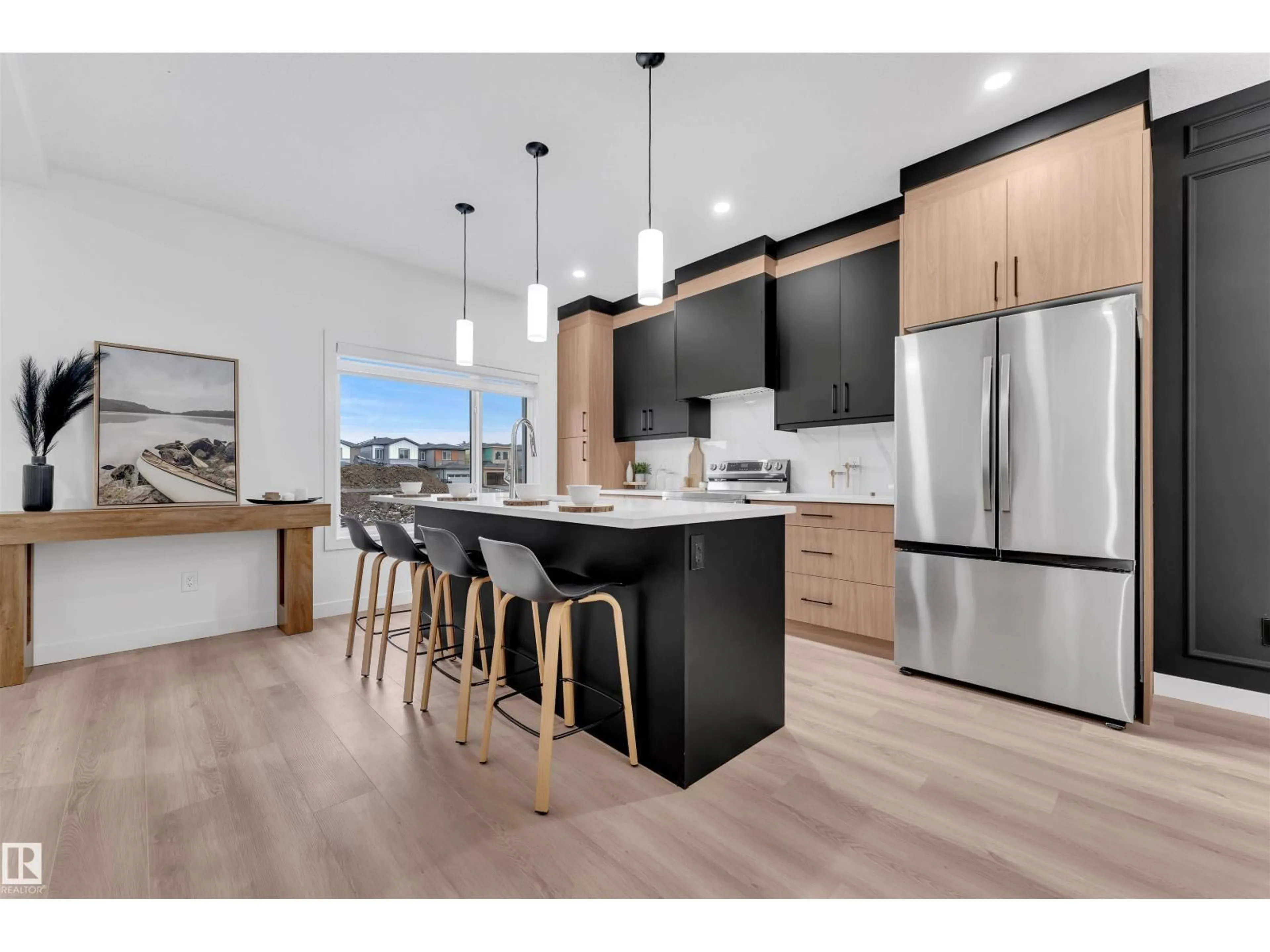 Open concept kitchen, wood/laminate floor for 7006 50A AVENUE, Beaumont Alberta T4X3G5