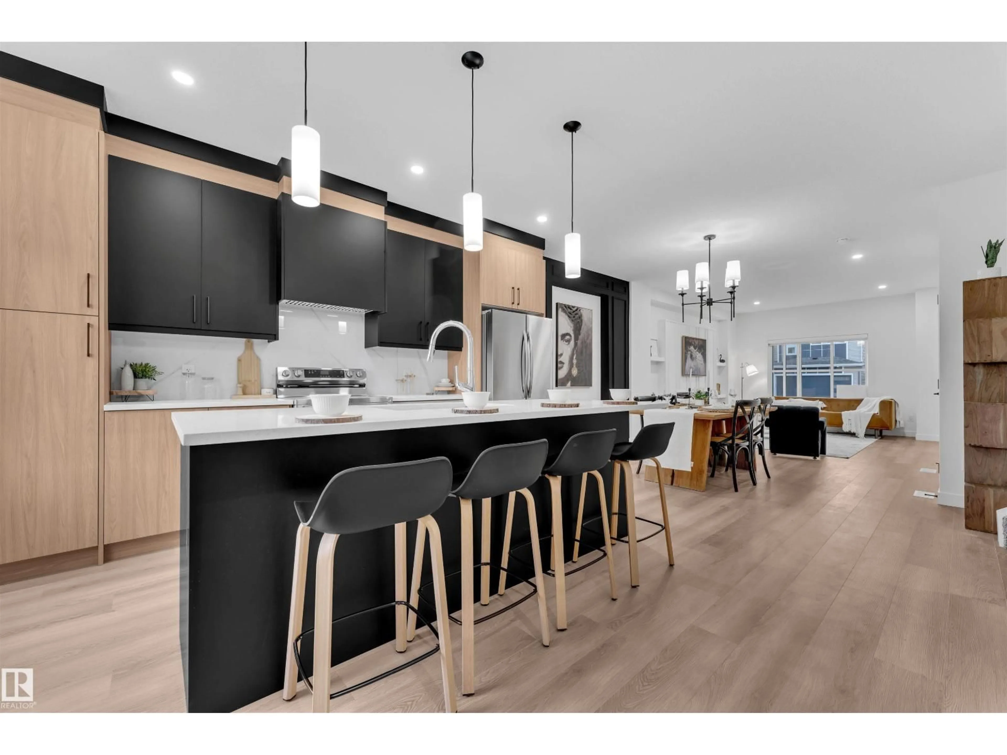 Open concept kitchen, wood/laminate floor for 7006 50A AVENUE, Beaumont Alberta T4X3G5