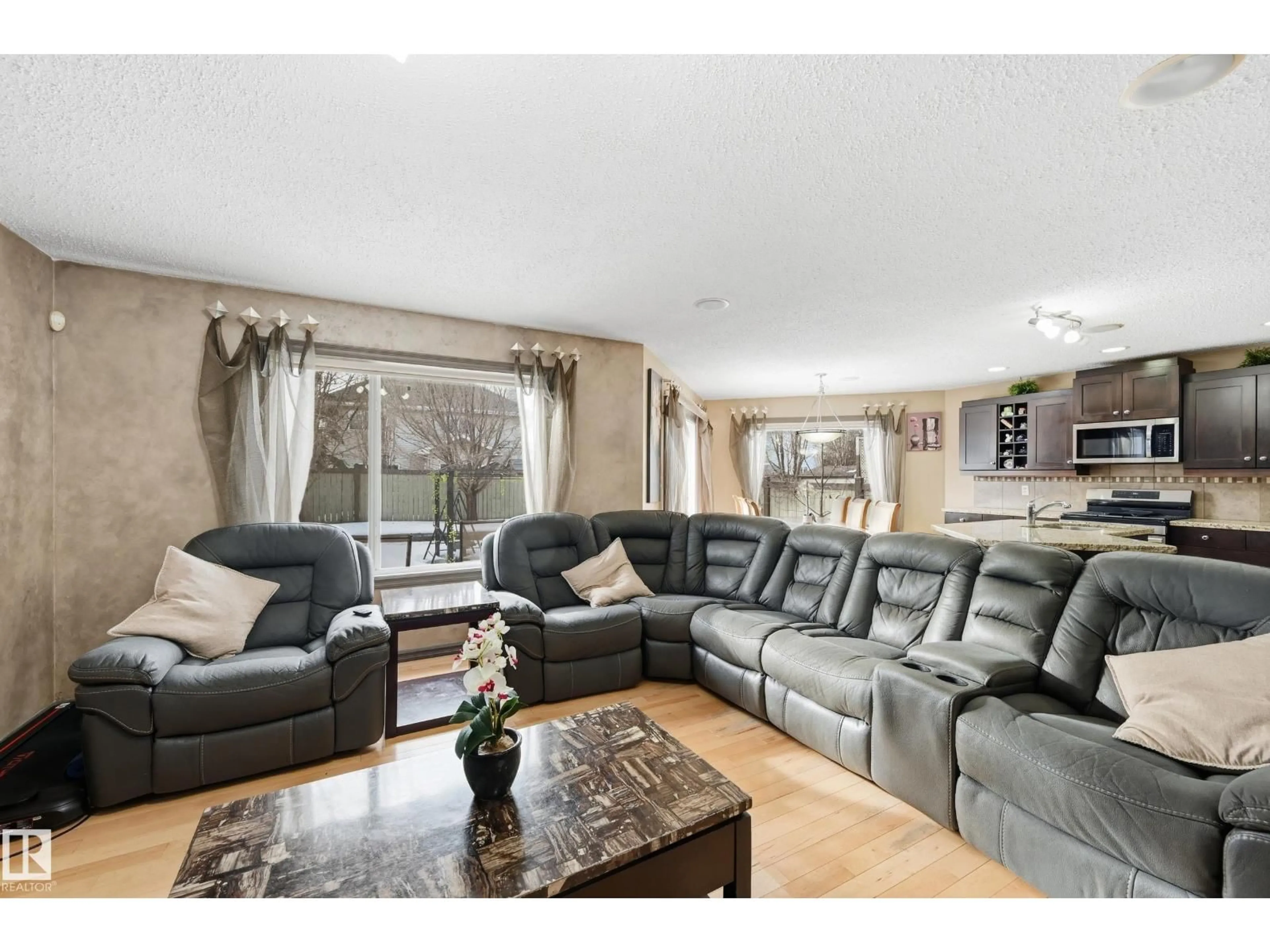 Living room with furniture, wood/laminate floor for 1440 POTTER GREENS DR, Edmonton Alberta T5T1J8