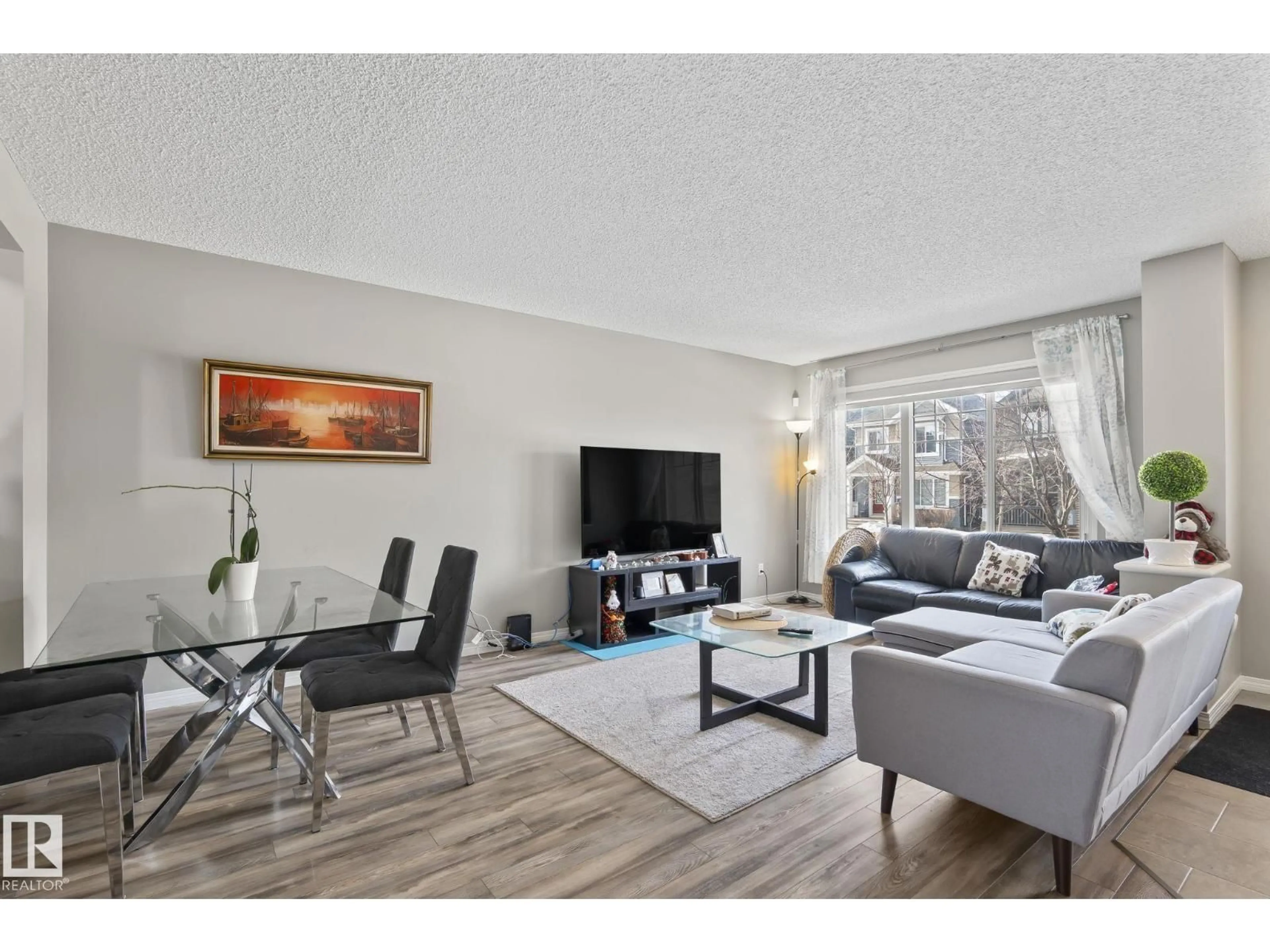 Living room with furniture, wood/laminate floor for SW SW - 3221 CHERRY CRES, Edmonton Alberta T6X1Y5