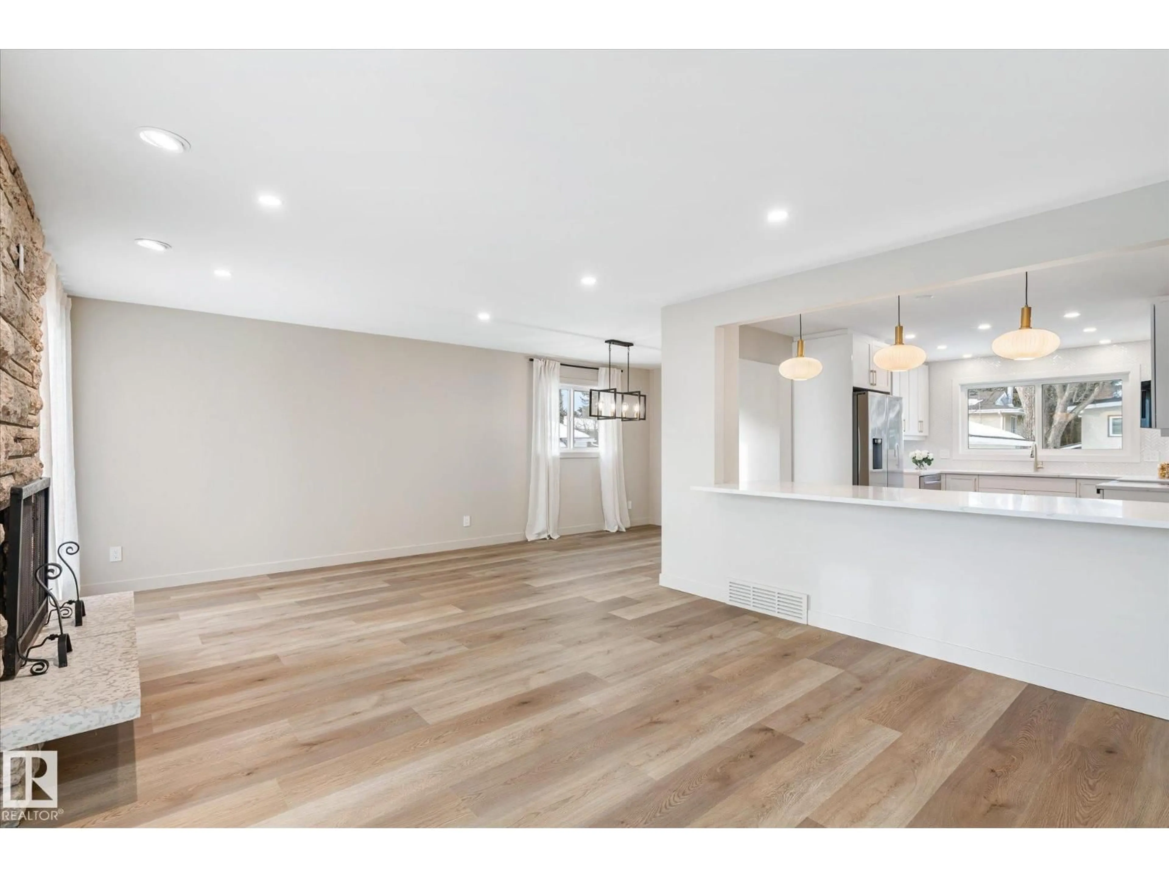 Open concept kitchen, wood/laminate floor for 4120 108 ST NW, Edmonton Alberta T6J2P8