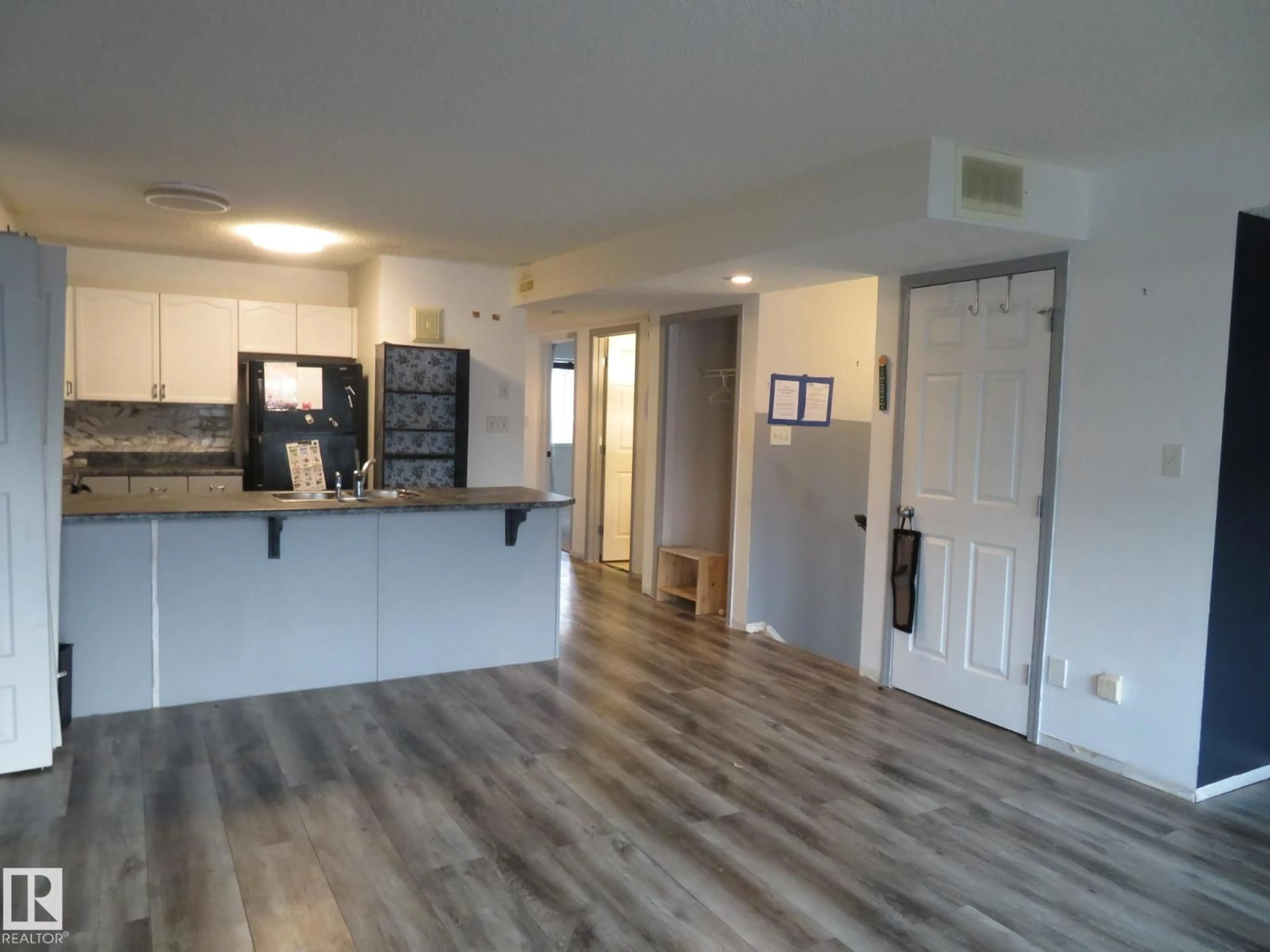 Open concept kitchen, wood/laminate floor for NW - 2945 26 ST, Edmonton Alberta T6T2A1
