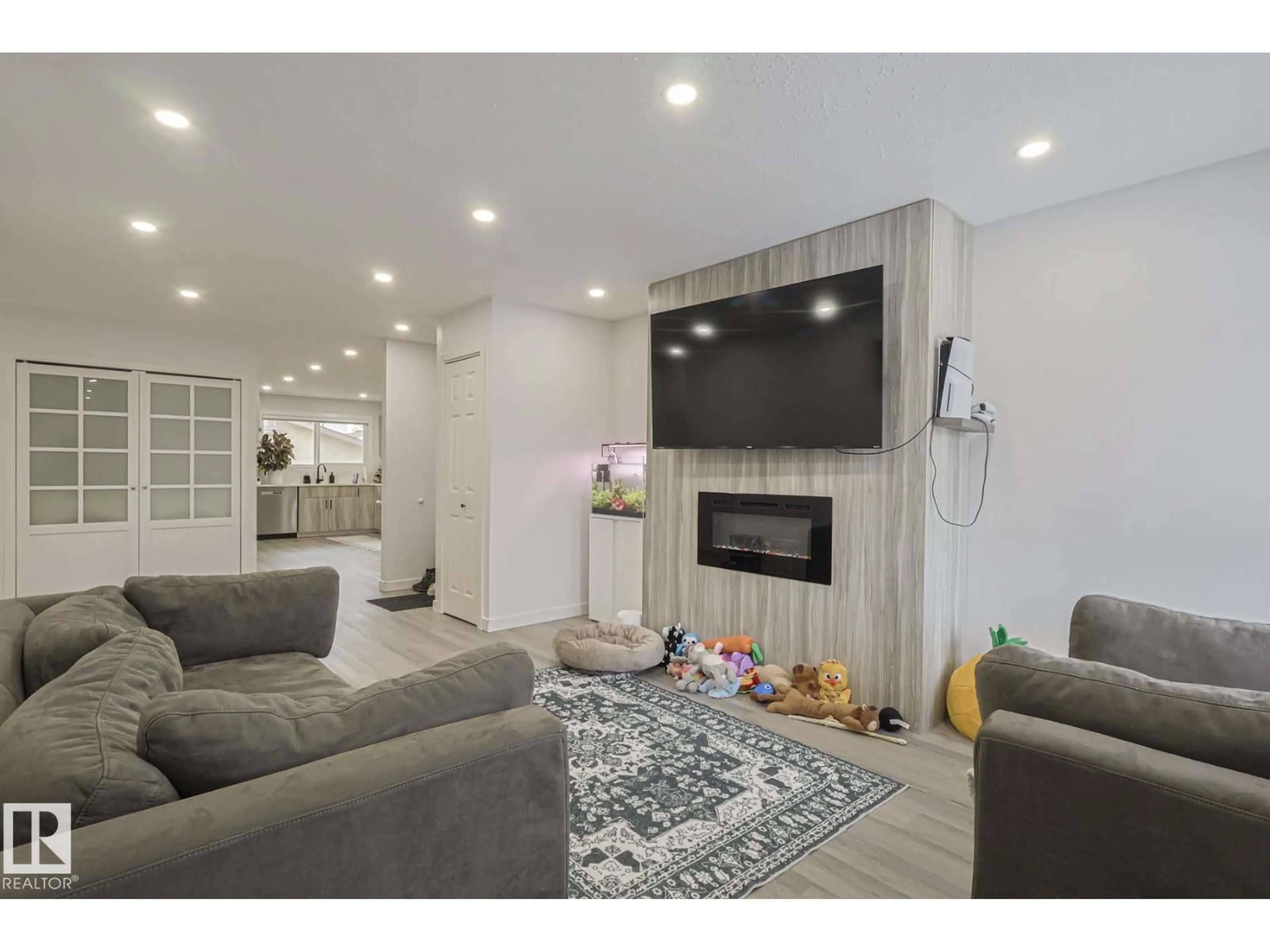 Living room with furniture, unknown for NW - 10103 172 AV, Edmonton Alberta T5X4V7