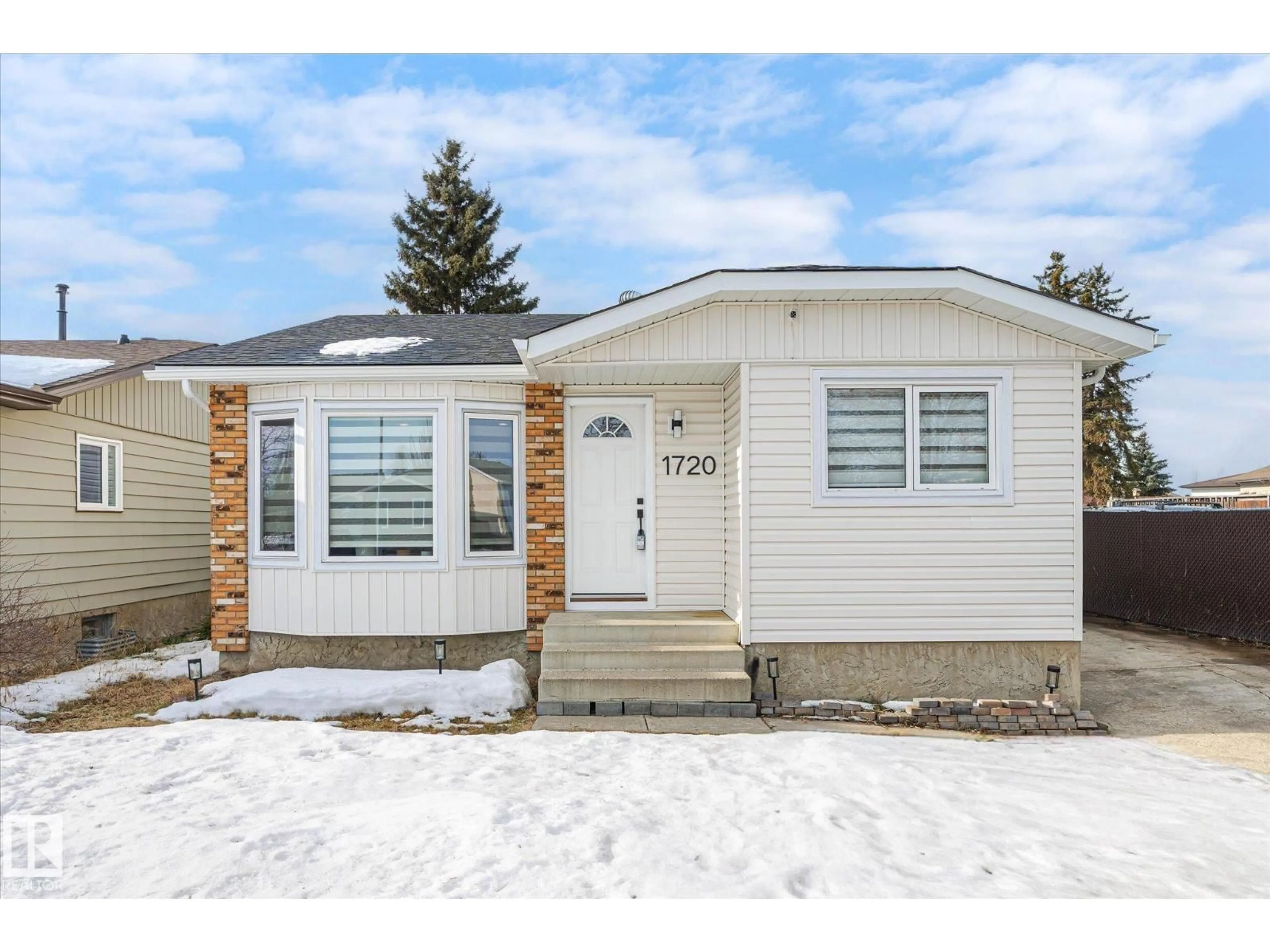 Home with vinyl exterior material, street for NW - 1720 35 ST, Edmonton Alberta T6L2P1