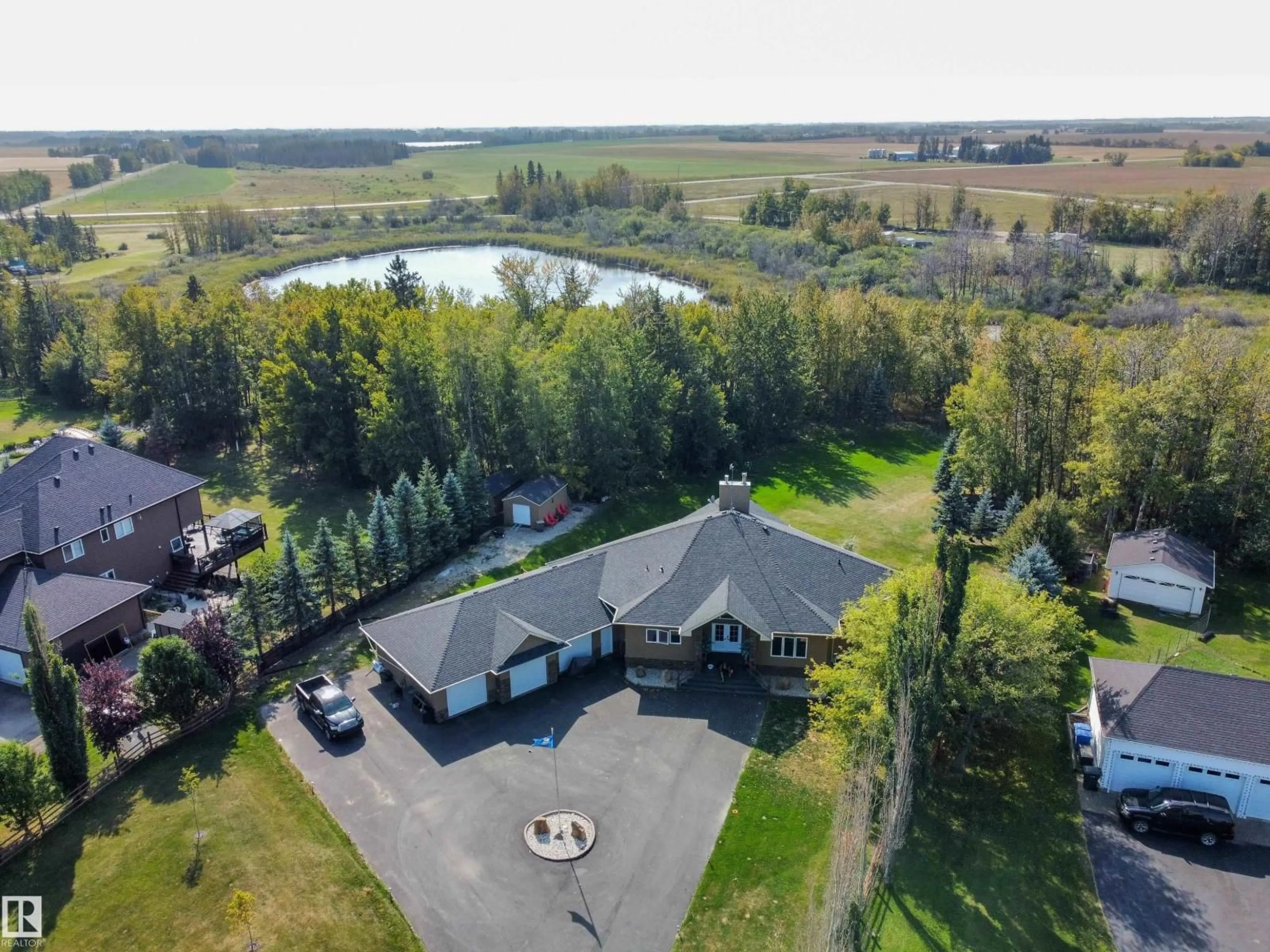 A pic from outside/outdoor area/front of a property/back of a property/a pic from drone, water/lake/river/ocean view for 52001 RGE ROAD 275, Rural Parkland County Alberta T7X3V2