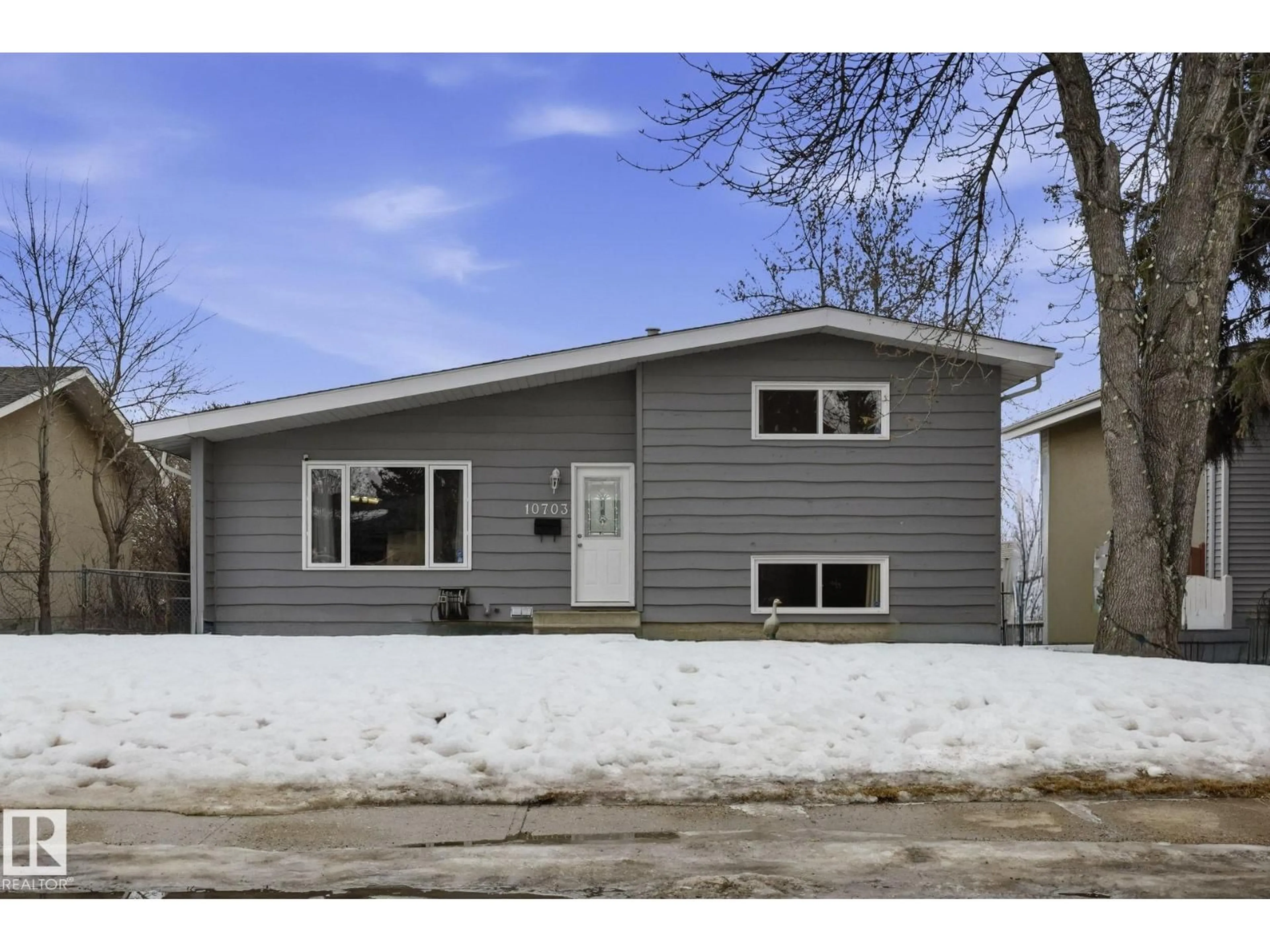 Home with vinyl exterior material, street for NW - 10703 31 ST, Edmonton Alberta T5W1W6