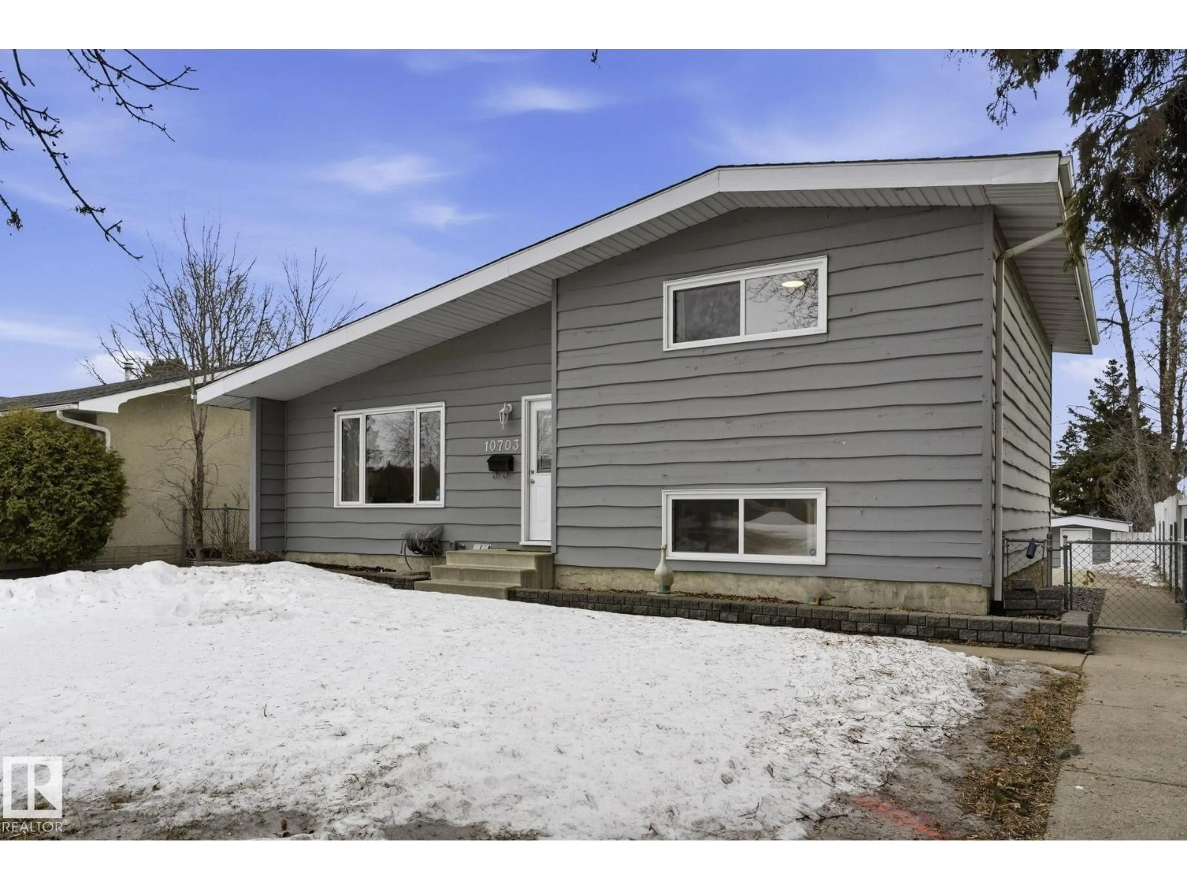 Home with vinyl exterior material, street for NW - 10703 31 ST, Edmonton Alberta T5W1W6