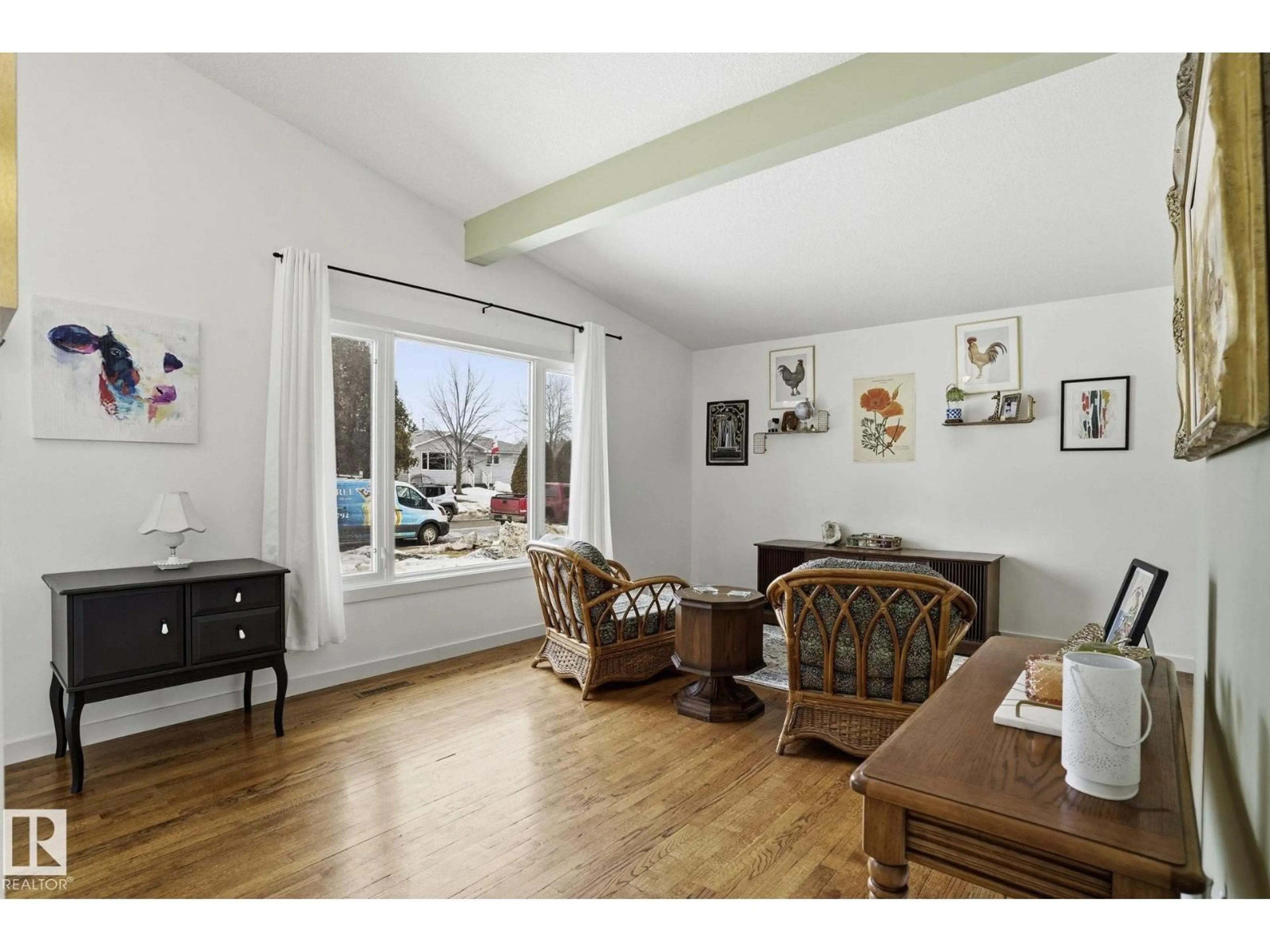 Living room with furniture, wood/laminate floor for NW - 10703 31 ST, Edmonton Alberta T5W1W6