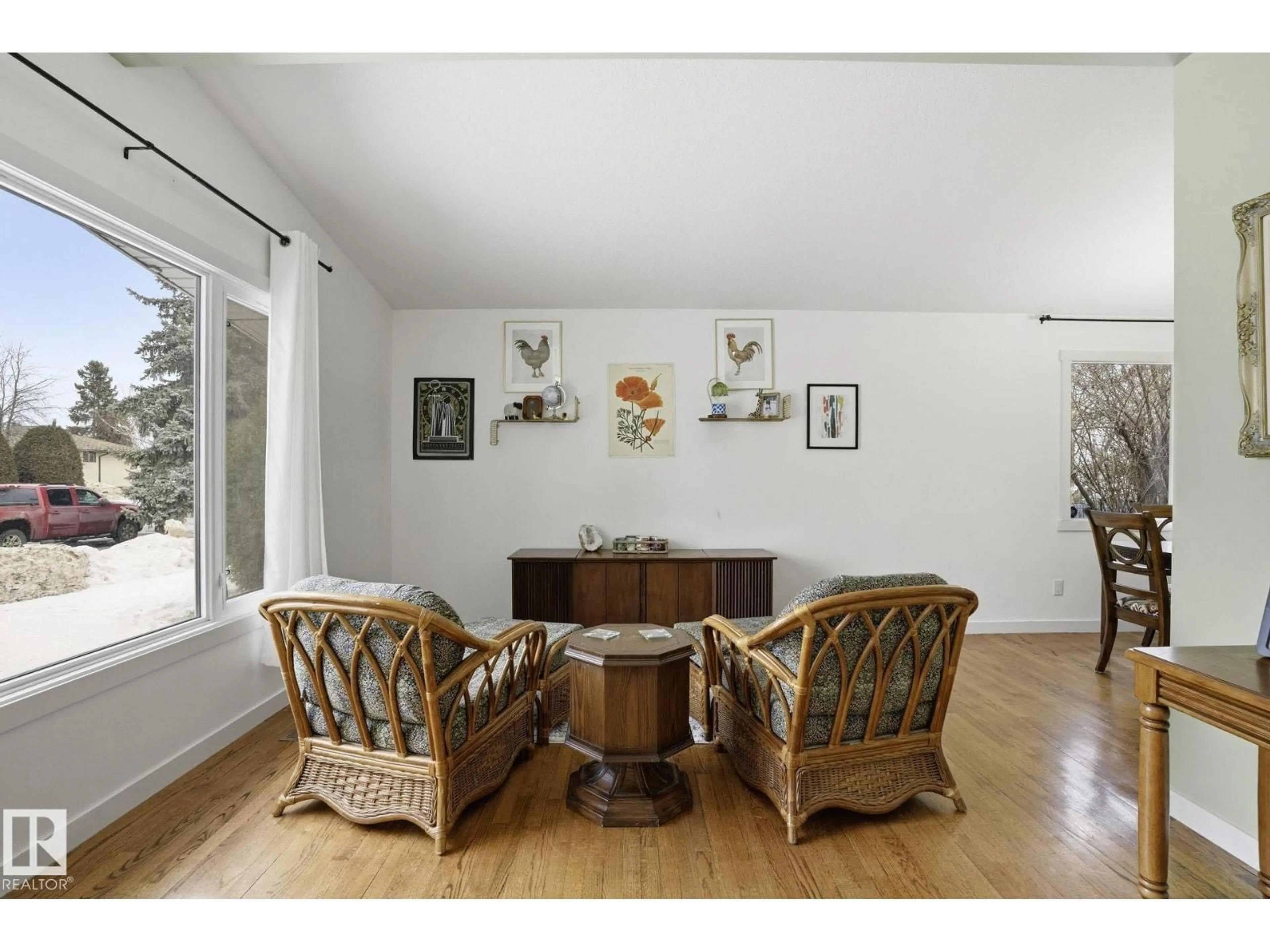 Living room with furniture, wood/laminate floor for NW - 10703 31 ST, Edmonton Alberta T5W1W6