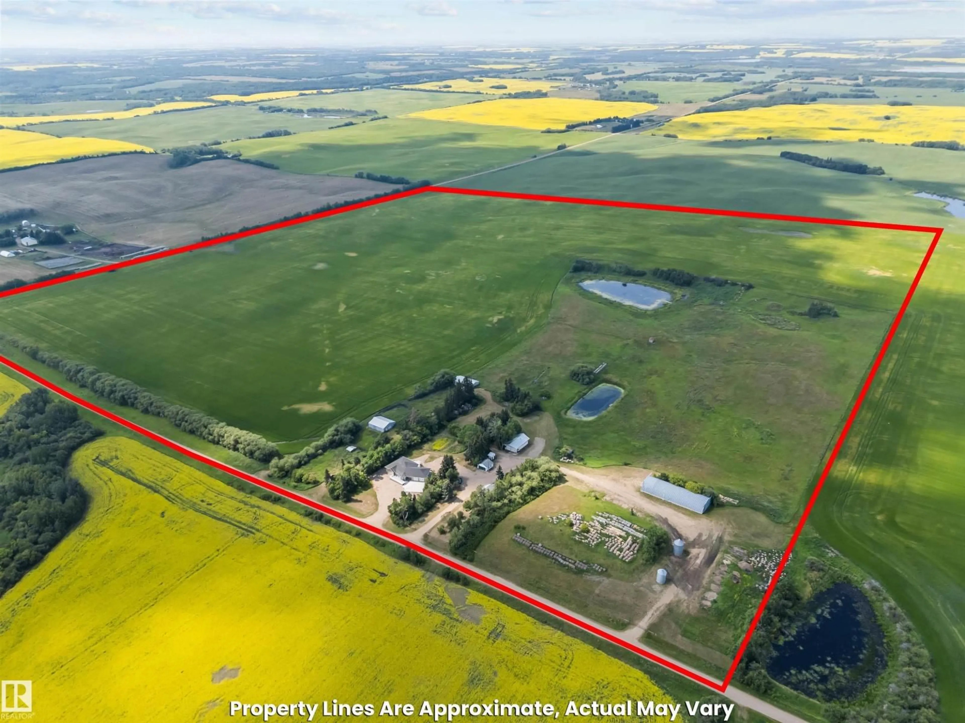 A pic from outside/outdoor area/front of a property/back of a property/a pic from drone, building for 564032-564034 RANGE ROAD 130, Rural Two Hills County Alberta T0B0P0