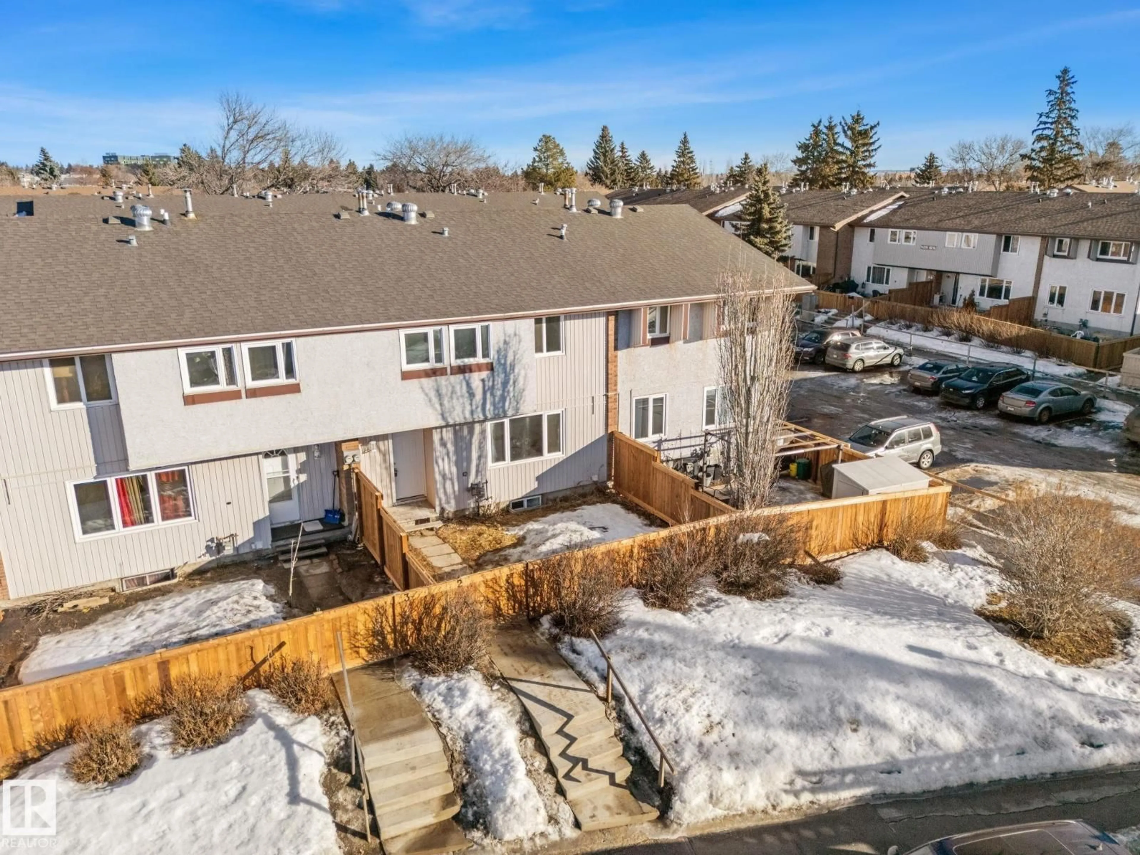 A pic from outside/outdoor area/front of a property/back of a property/a pic from drone, mountain view for #2 - 14235 82 ST, Edmonton Alberta T5E2V7