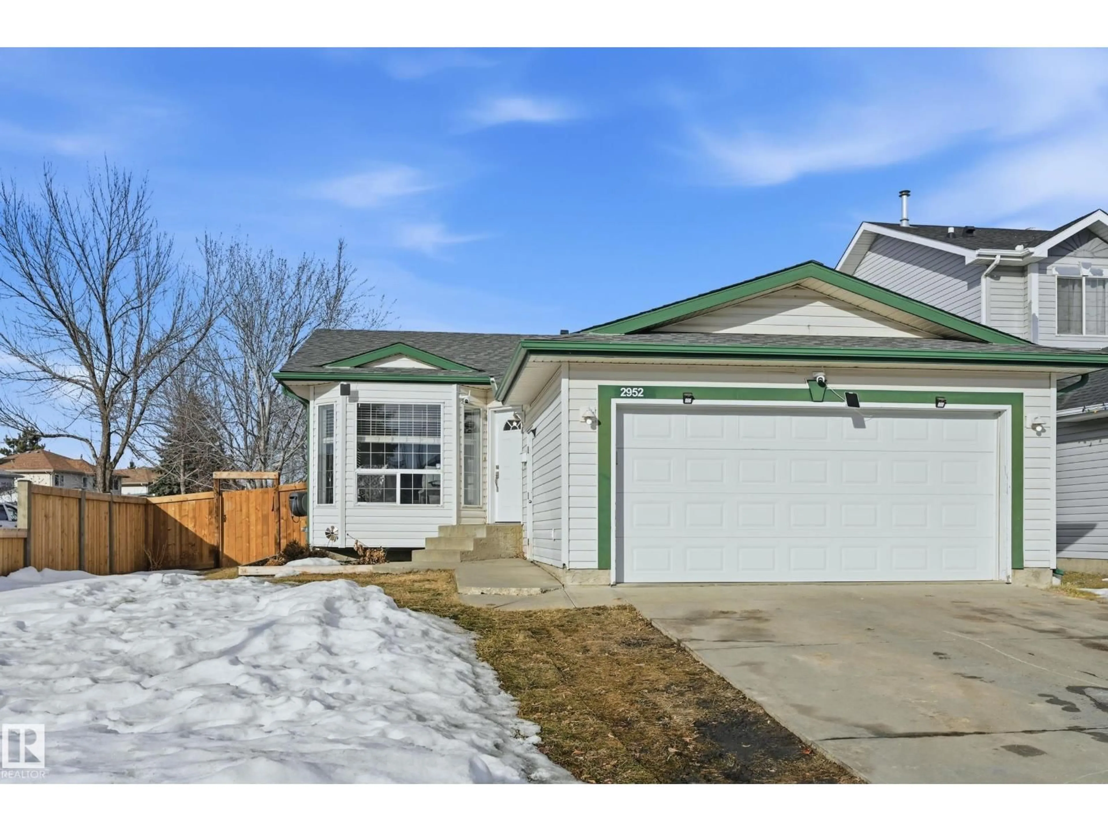 Home with vinyl exterior material, street for NW - 2952 39 AV, Edmonton Alberta T6T1L2