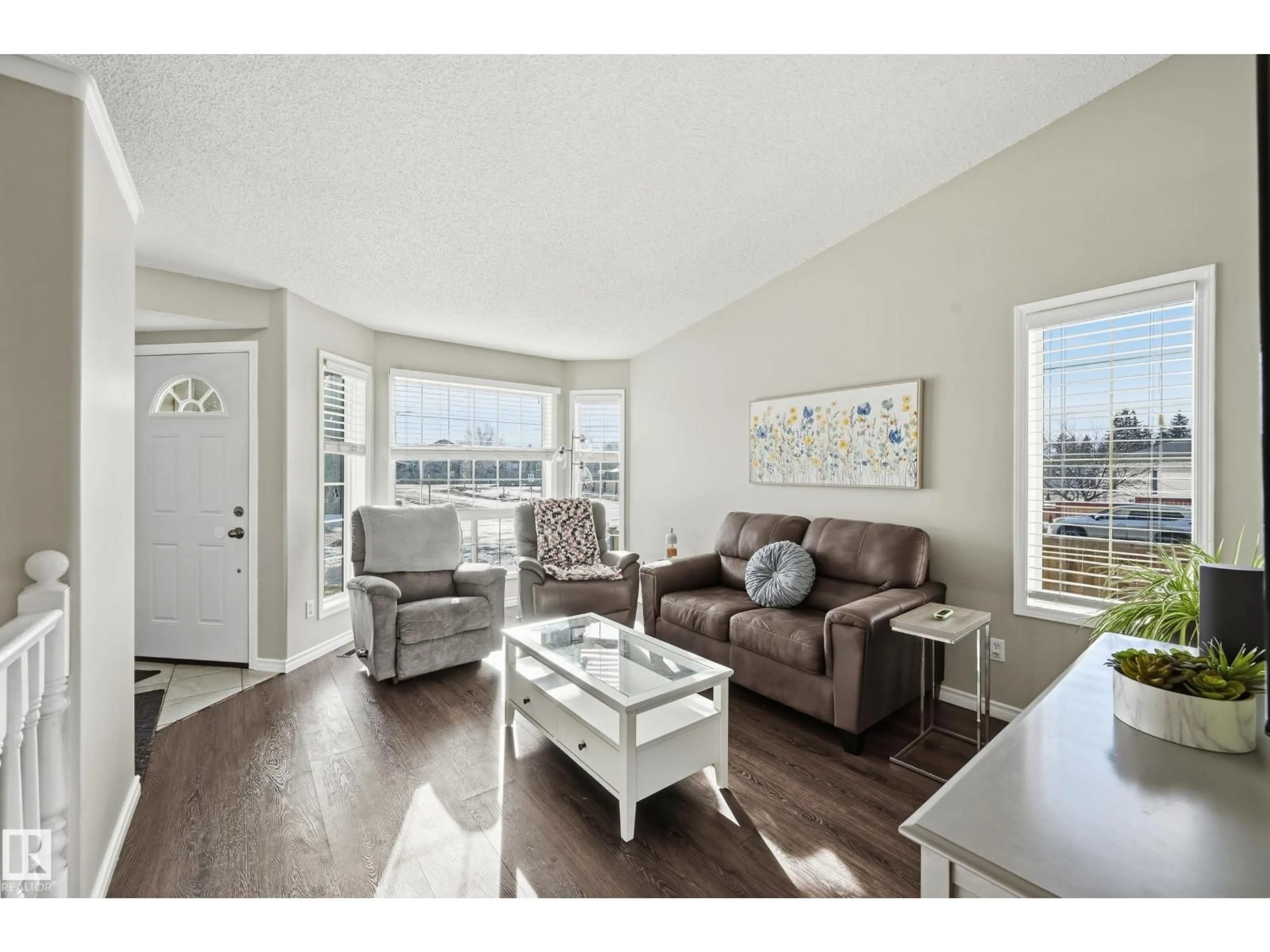 Living room with furniture, wood/laminate floor for NW - 2952 39 AV, Edmonton Alberta T6T1L2