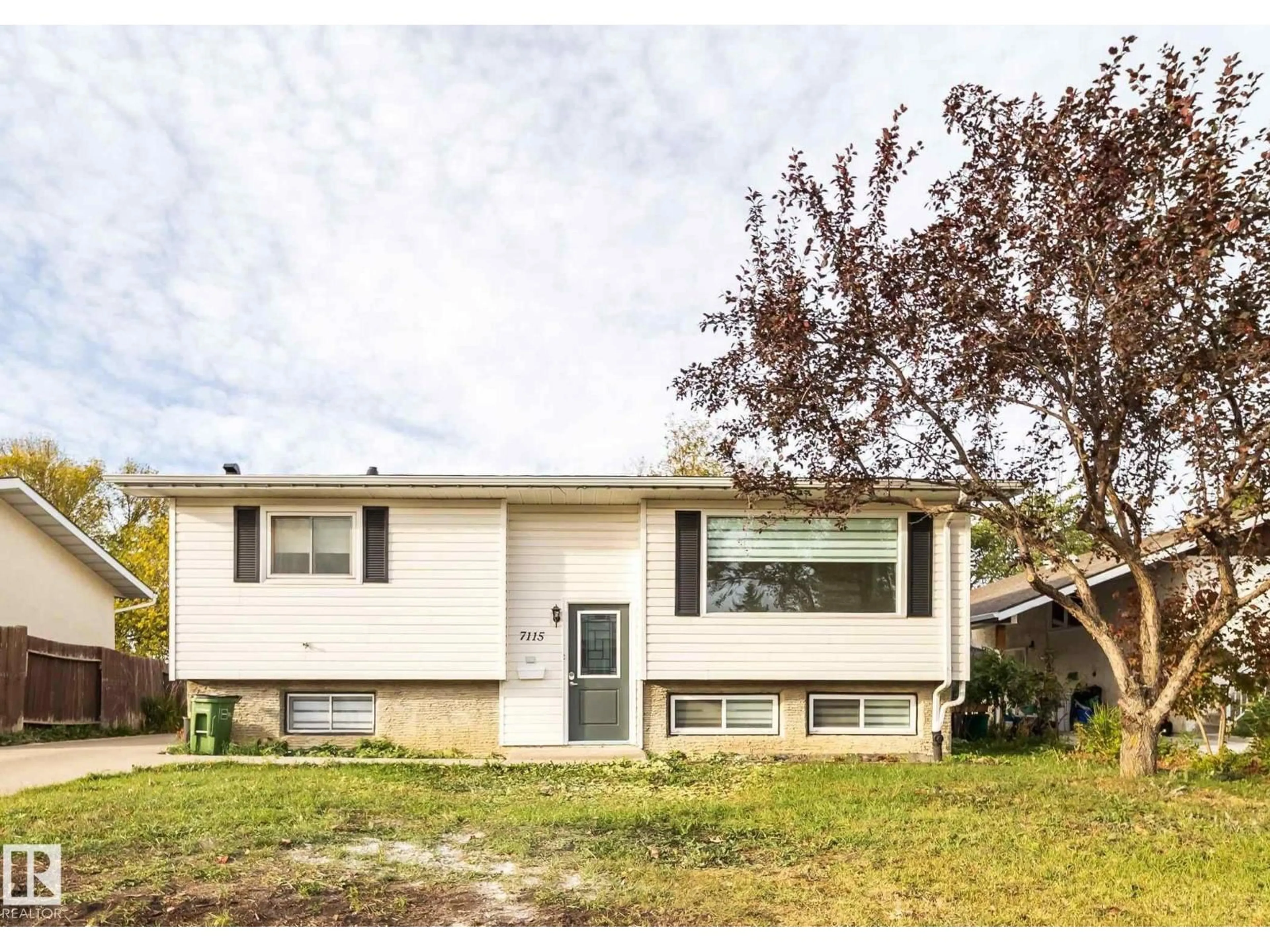 Home with vinyl exterior material, street for 7115 12 AV, Edmonton Alberta T6K3H6