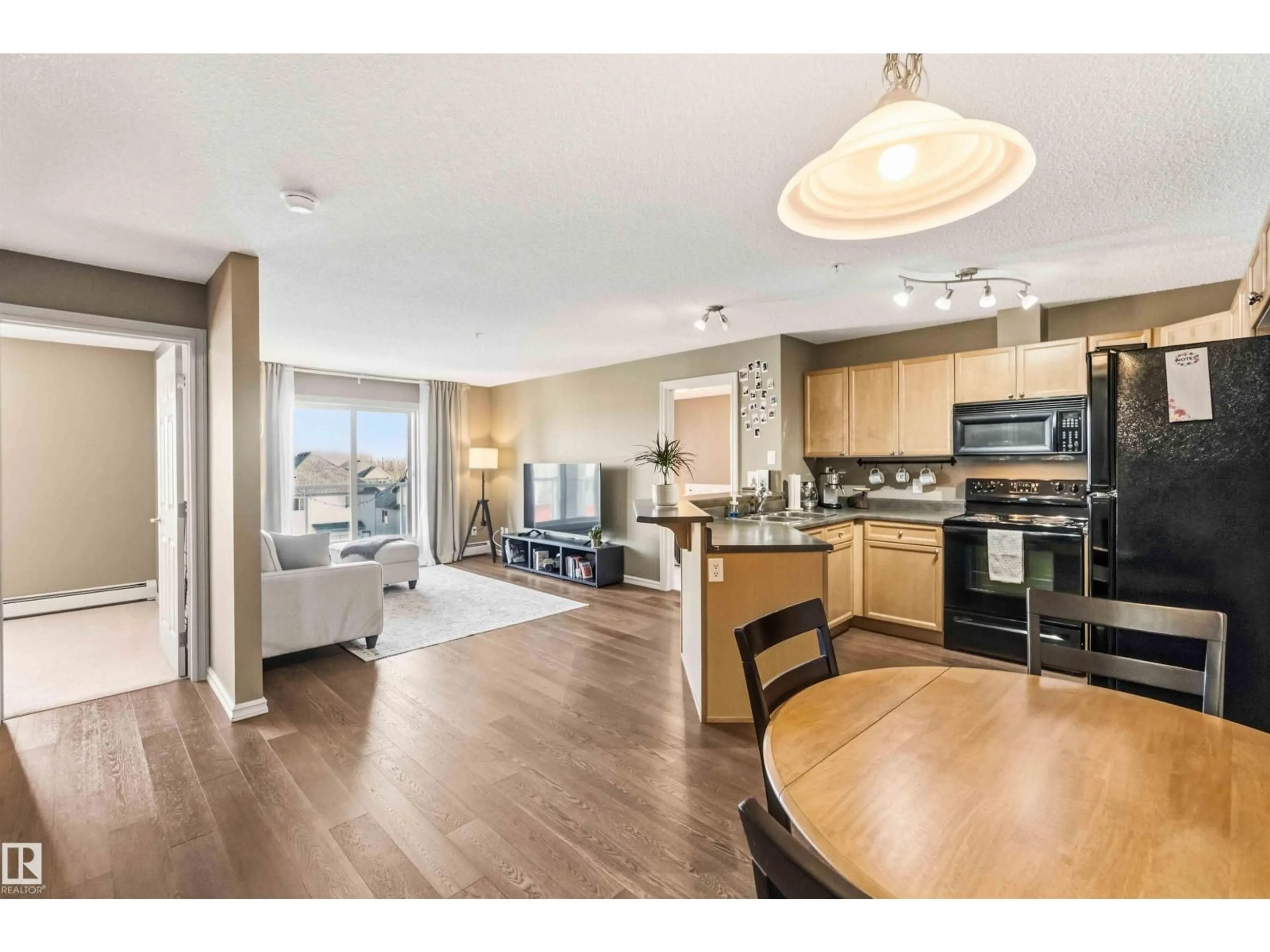 Open concept kitchen, wood/laminate floor for #305 - 13710 150 AV, Edmonton Alberta T6V0B2