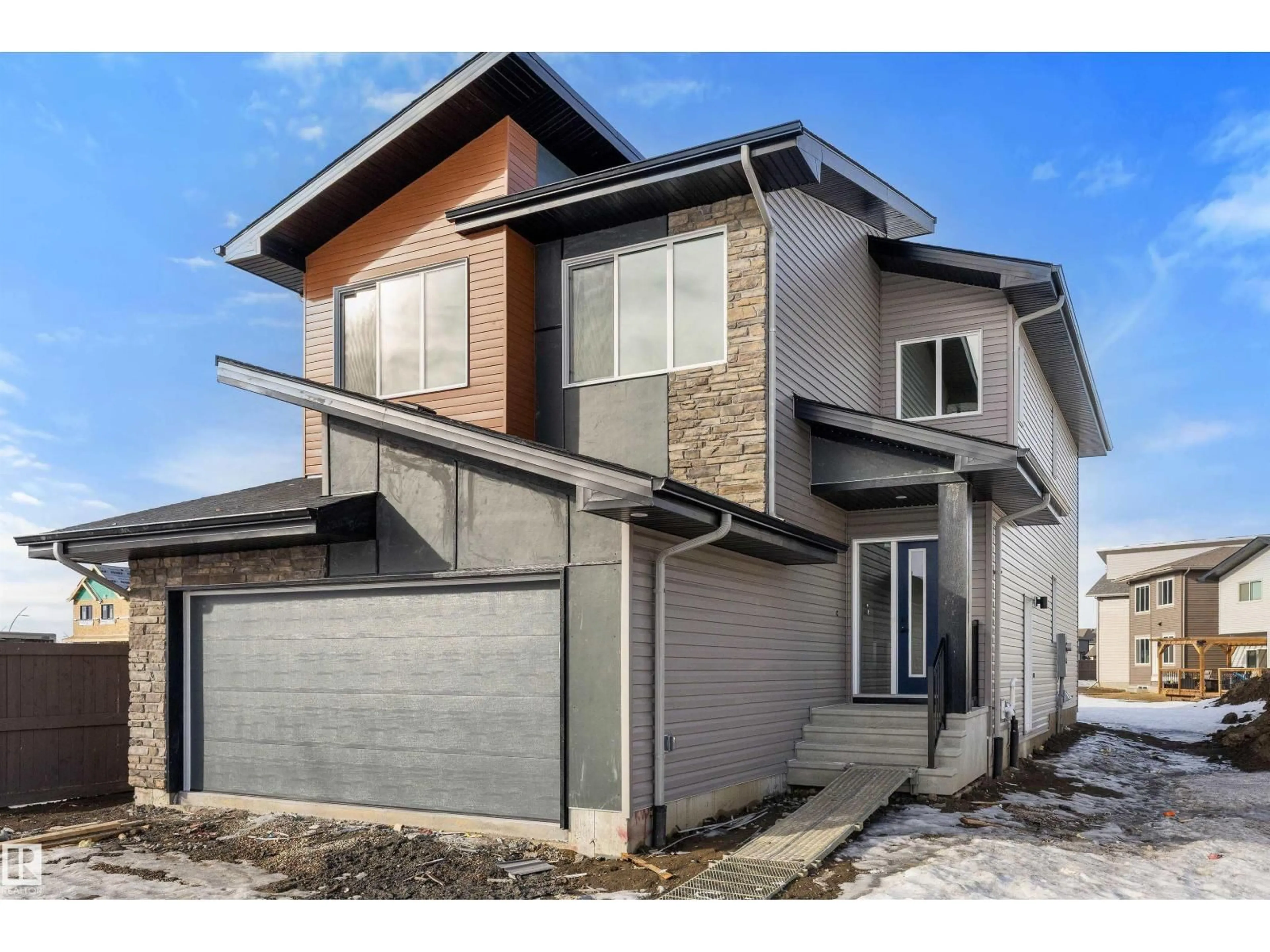 Home with brick exterior material, street for NW - 19428 25 AV, Edmonton Alberta T6M1P5