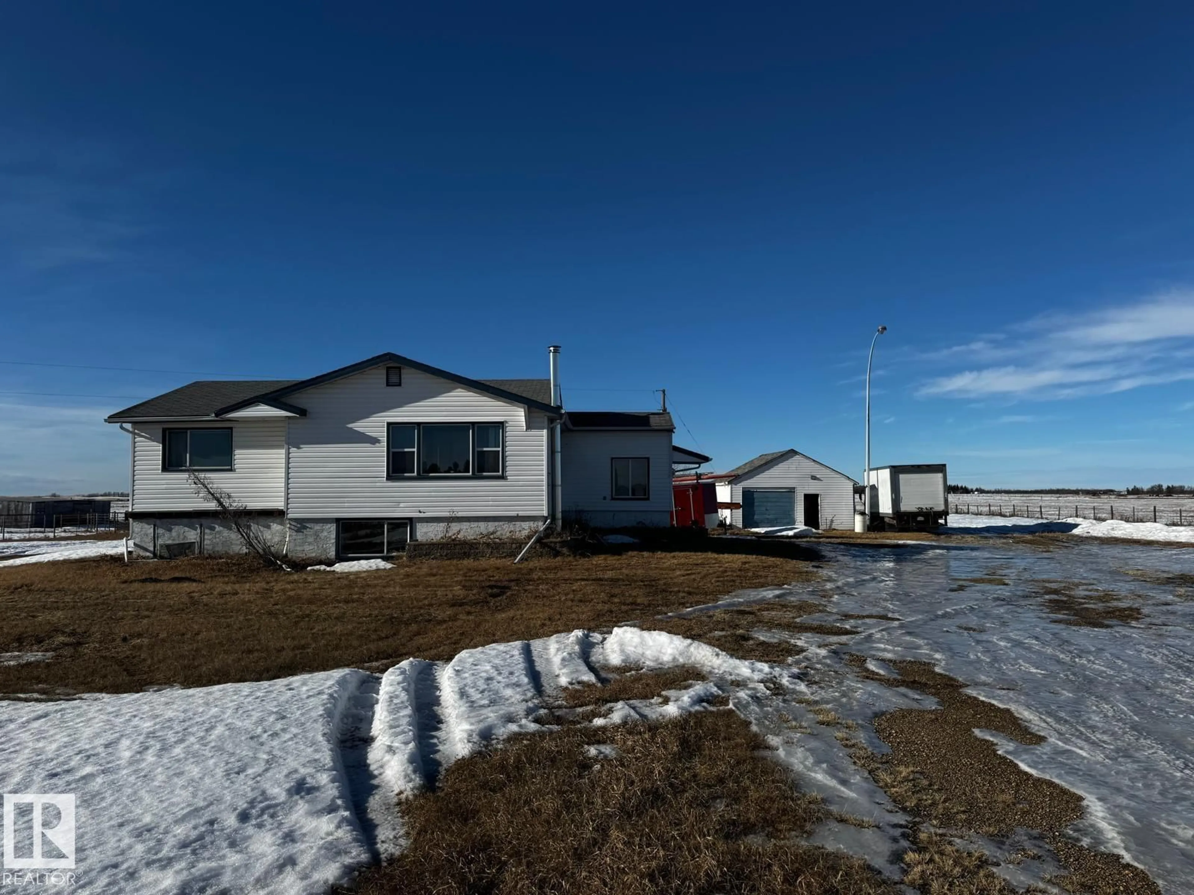 A pic from outside/outdoor area/front of a property/back of a property/a pic from drone, unknown for 48548 HWY 2 A, Rural Leduc County Alberta T4X2S4