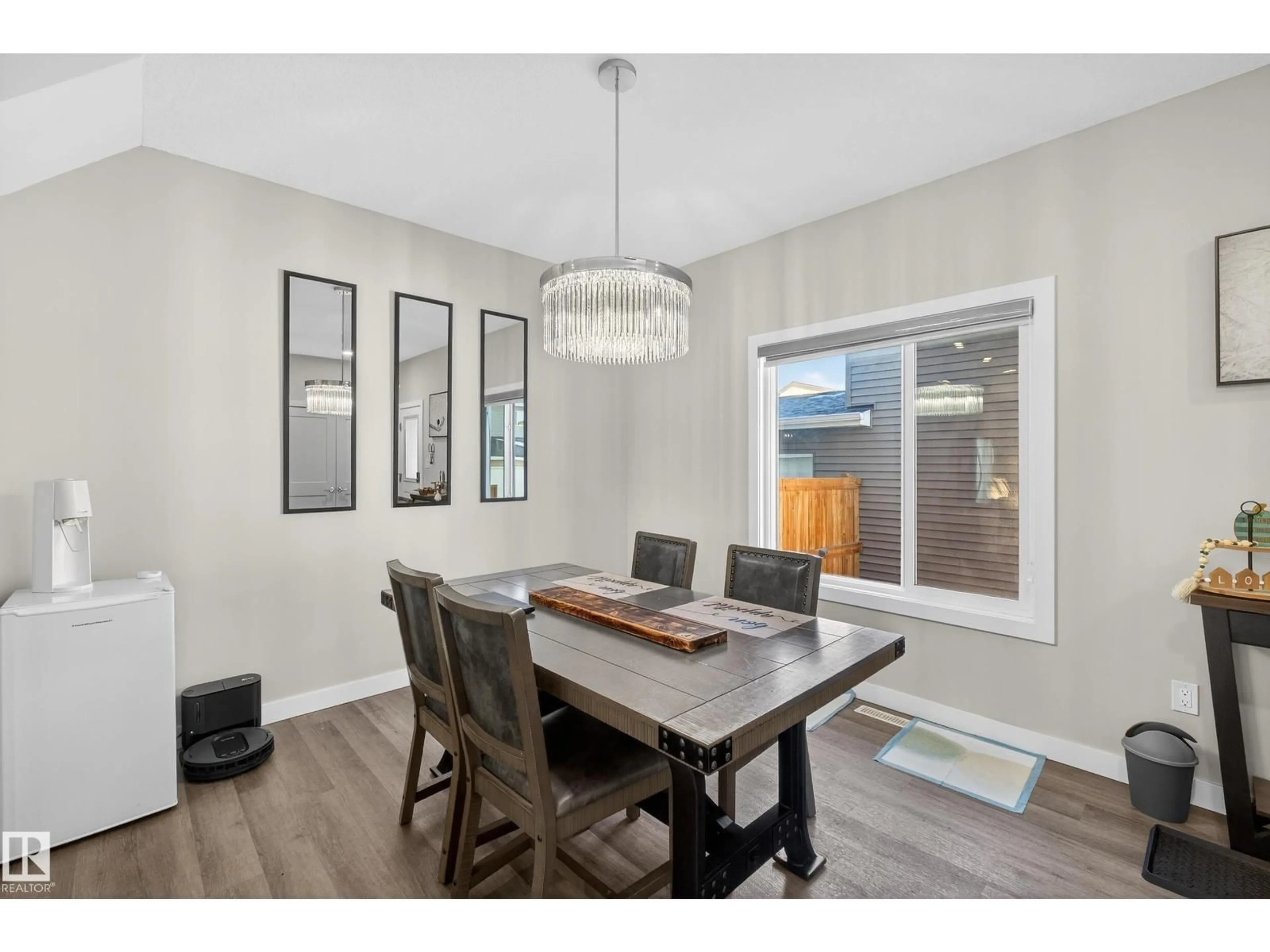 Dining room, wood/laminate floor for 401 BLACK STONE LI, Leduc Alberta T9E1L8