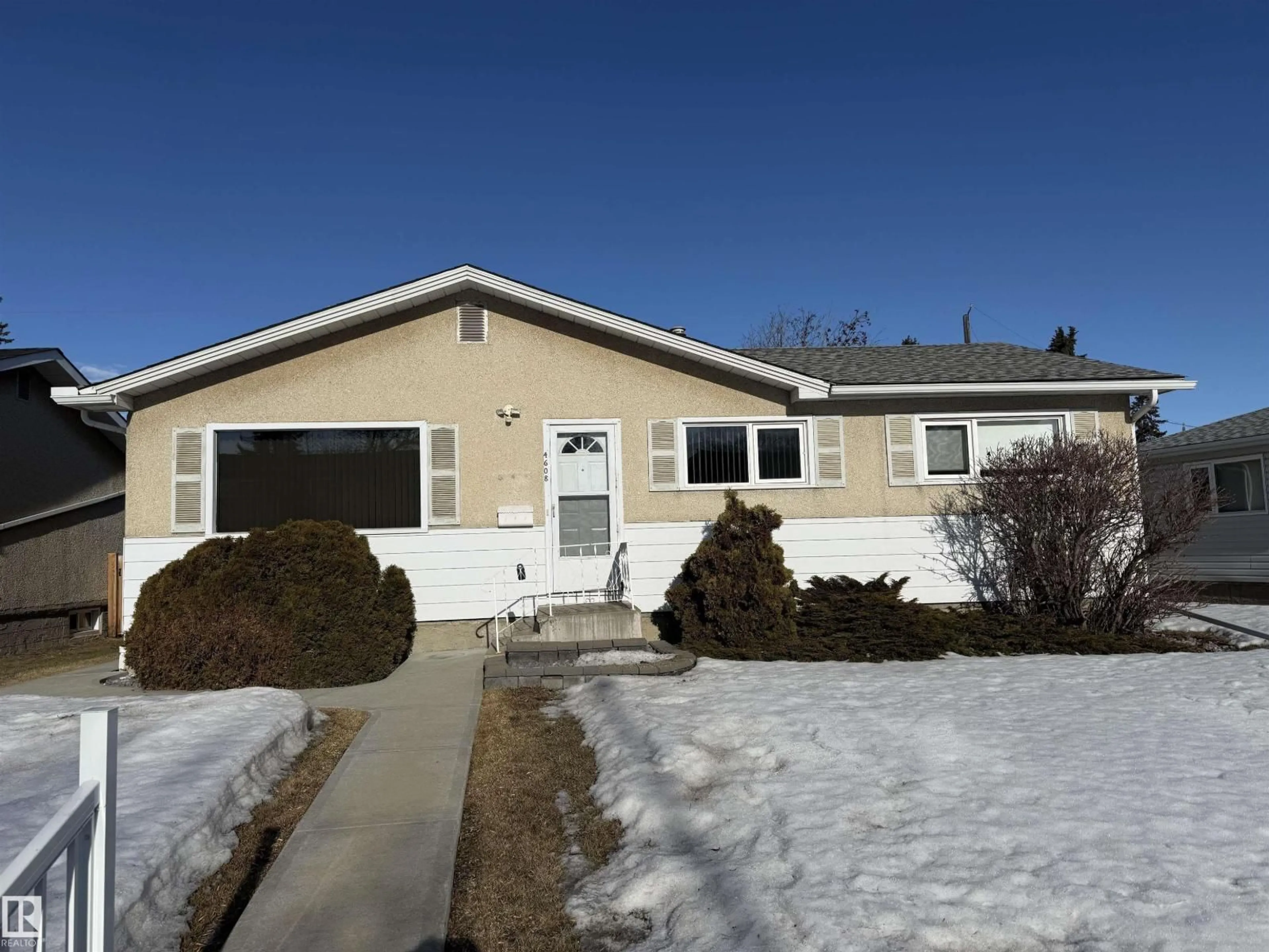 Home with vinyl exterior material, street for 4608 102 AV, Edmonton Alberta T6A0M7