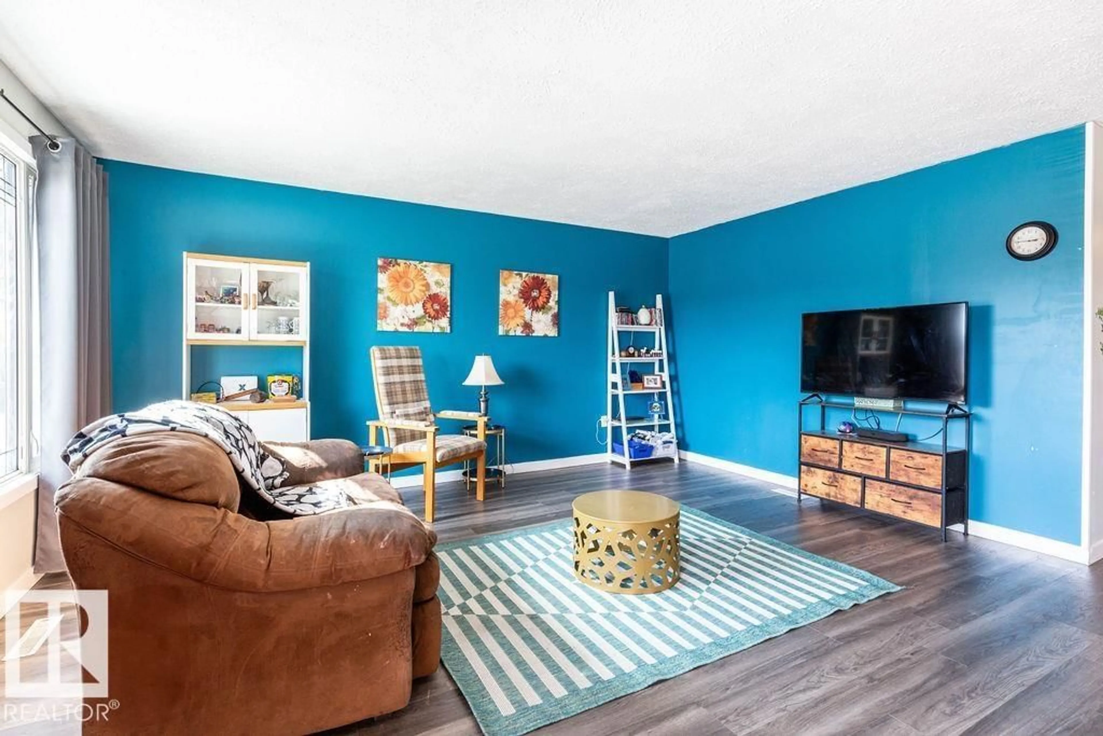 Living room with furniture, wood/laminate floor for 4628 46 AVE, Evansburg Alberta T0E0T0