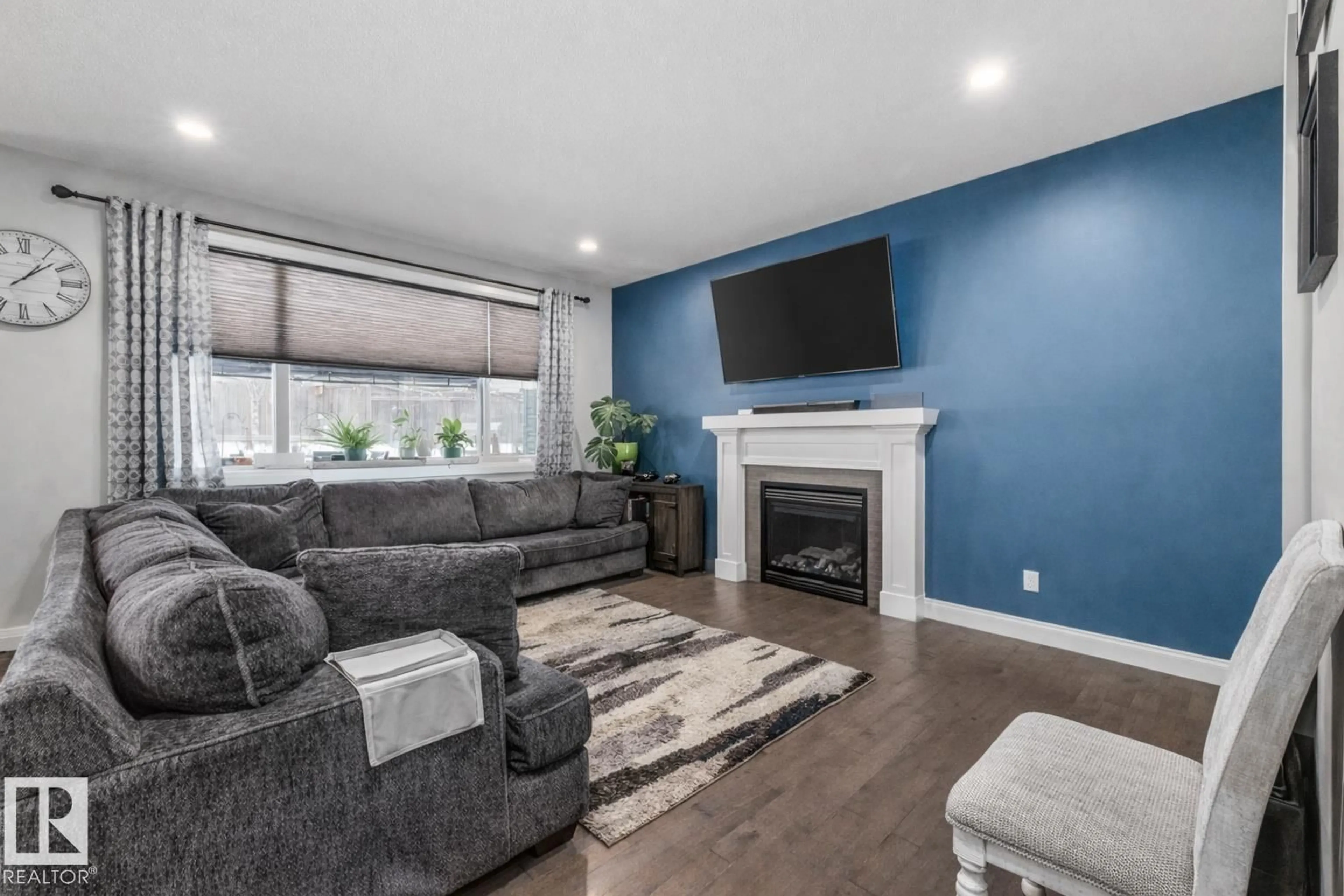 Living room with furniture, wood/laminate floor for 14 SPRING BA, Spruce Grove Alberta T7X0L5