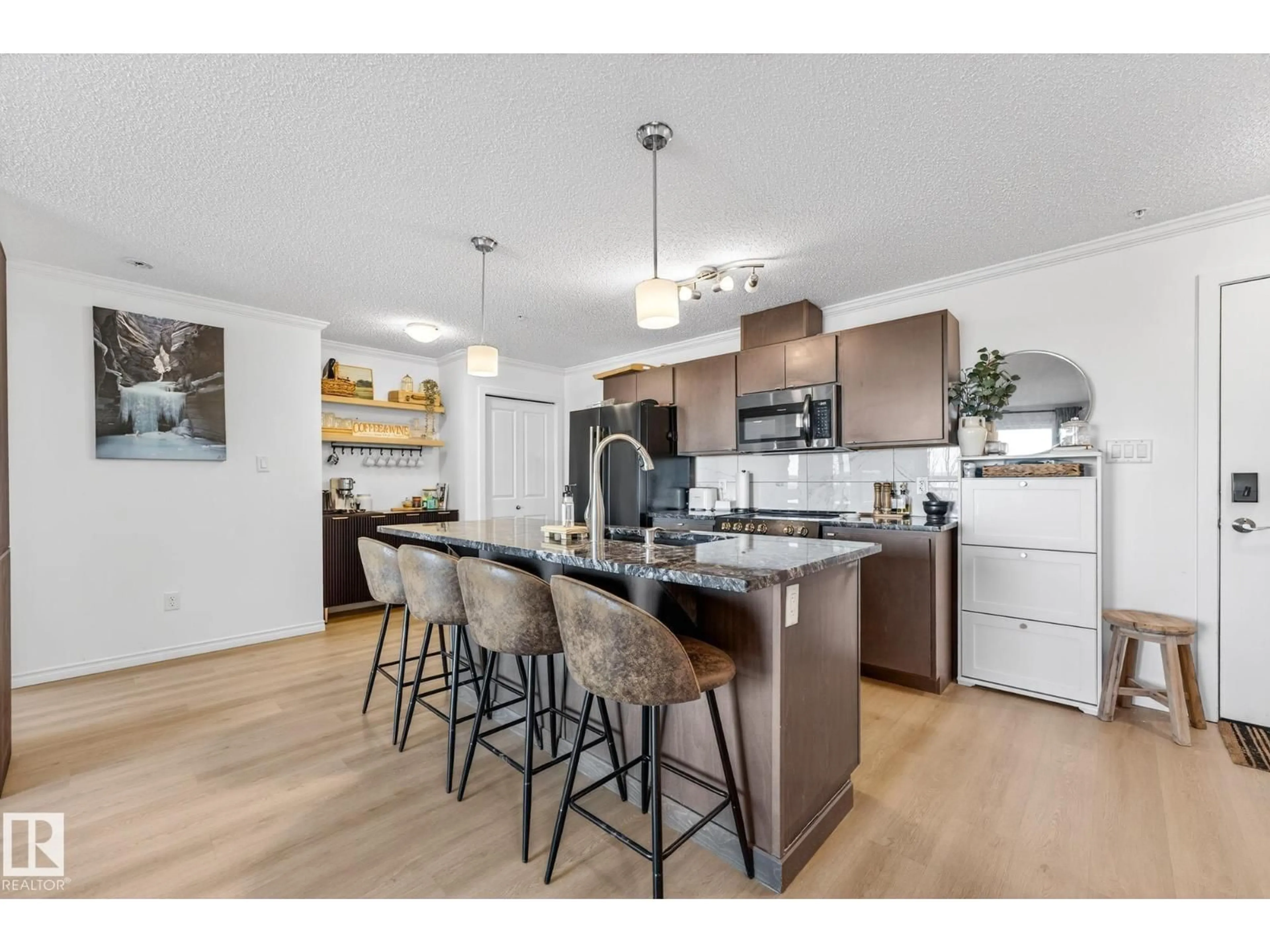 Open concept kitchen, wood/laminate floor for #357 - 1196 HYNDMAN RD, Edmonton Alberta T5A0X8