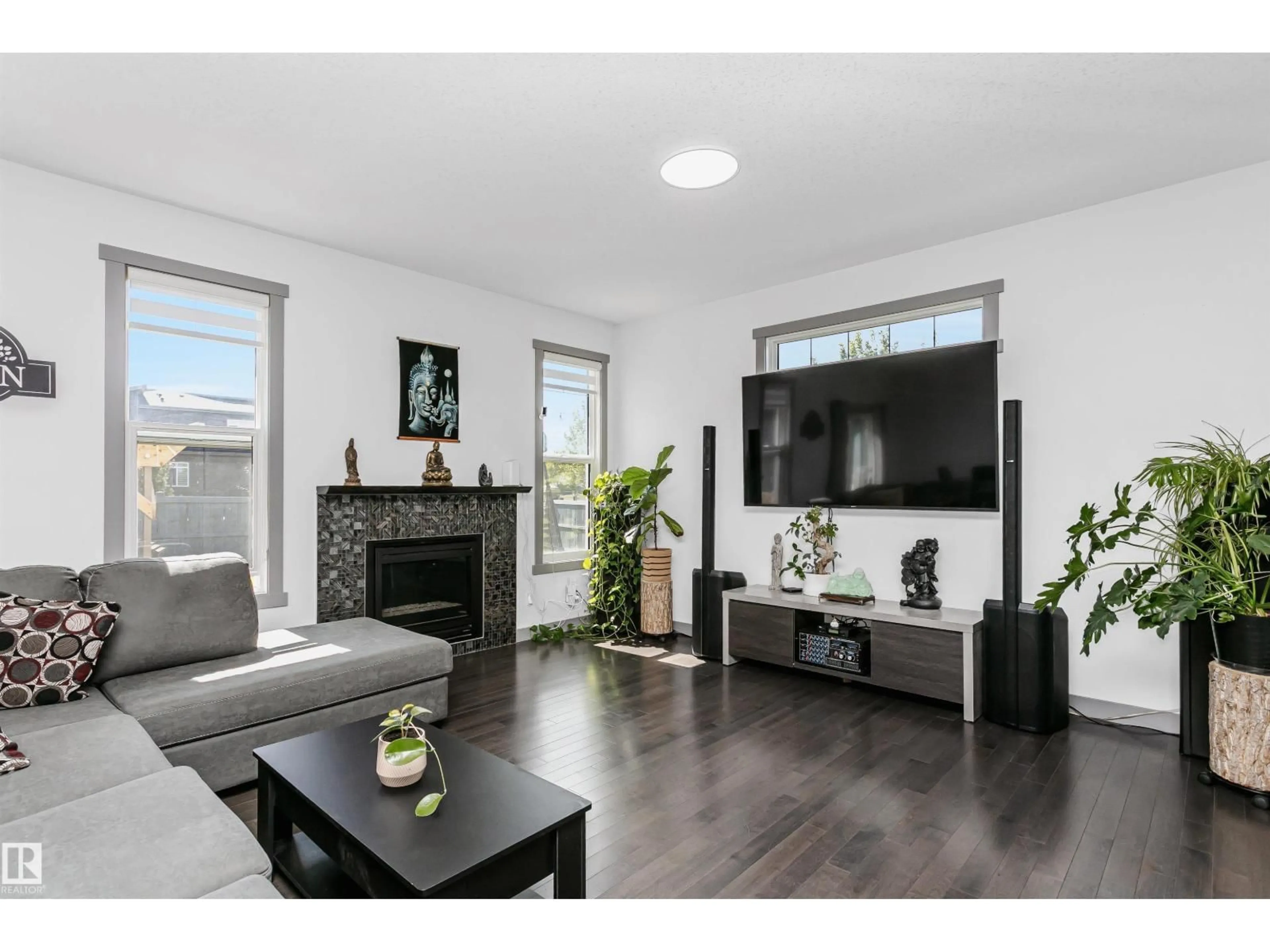 Living room with furniture, wood/laminate floor for NW - 7703 GETTY WD, Edmonton Alberta T5T4K9