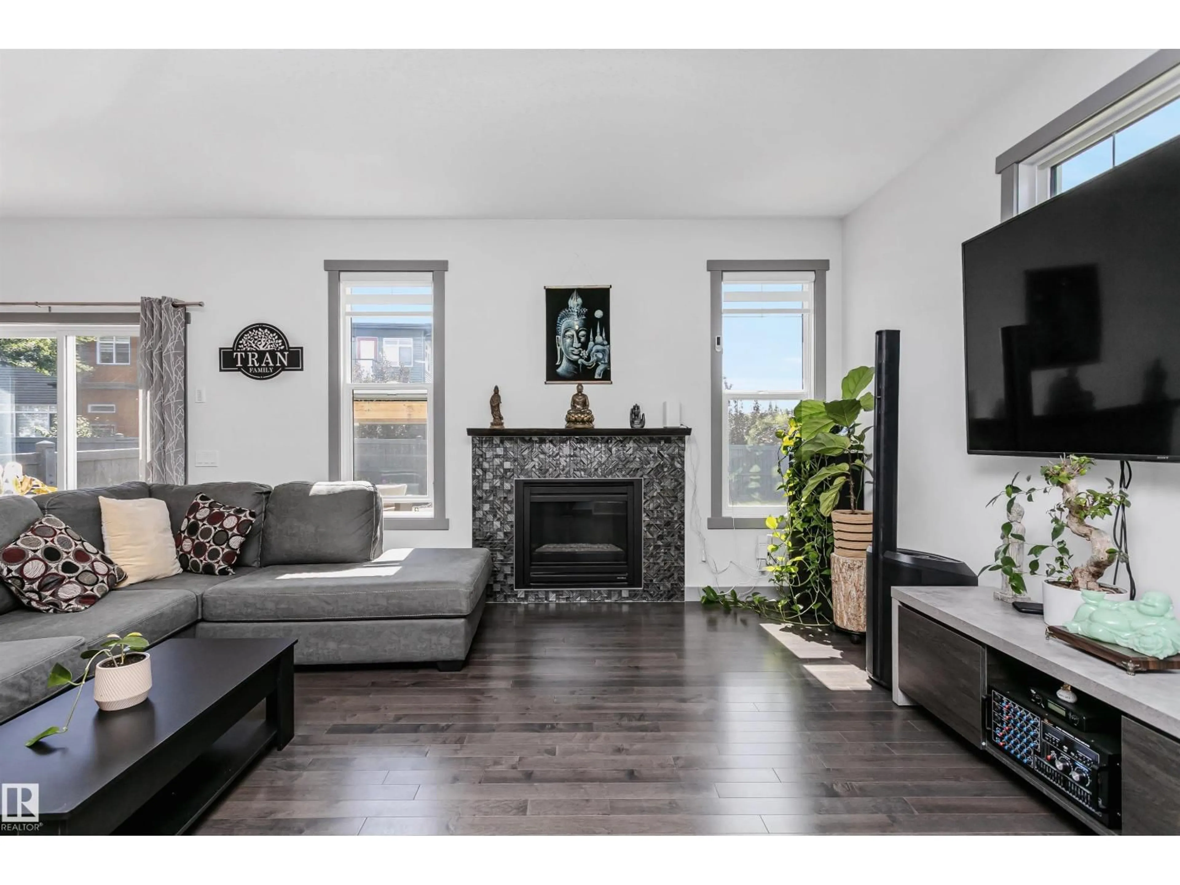 Living room with furniture, wood/laminate floor for NW - 7703 GETTY WD, Edmonton Alberta T5T4K9