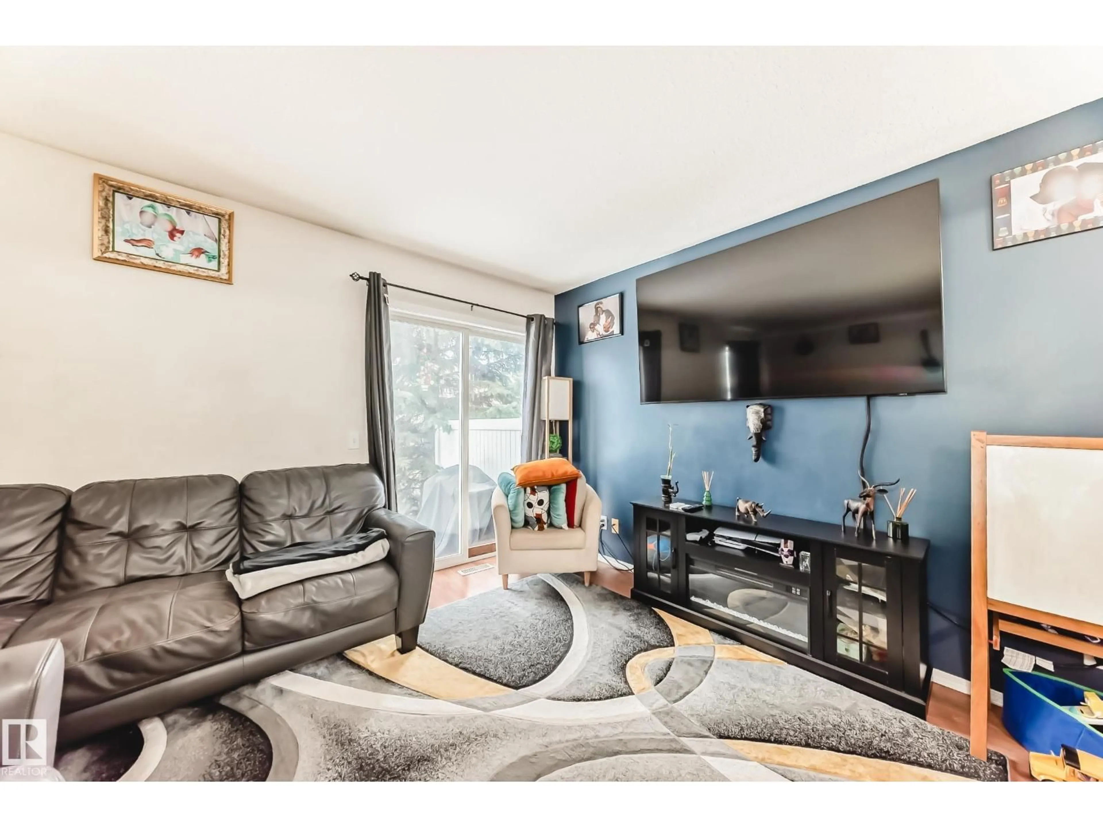 Living room with furniture, unknown for 38-150 EDWARDS DR, Edmonton Alberta T6X1M4