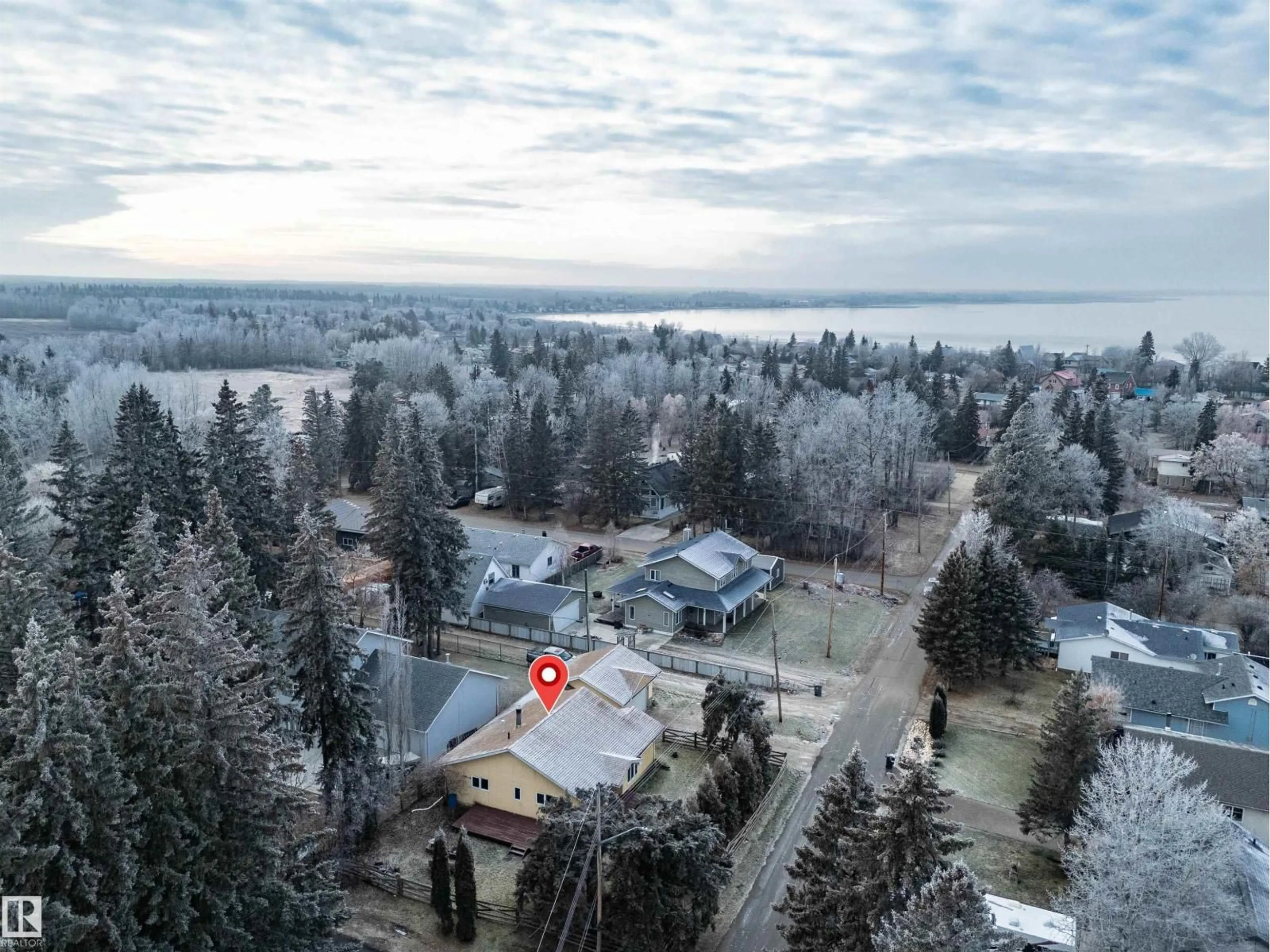 A pic from outside/outdoor area/front of a property/back of a property/a pic from drone, water/lake/river/ocean view for 5220 47A AV, Rural Lac Ste. Anne County Alberta T0E0A0