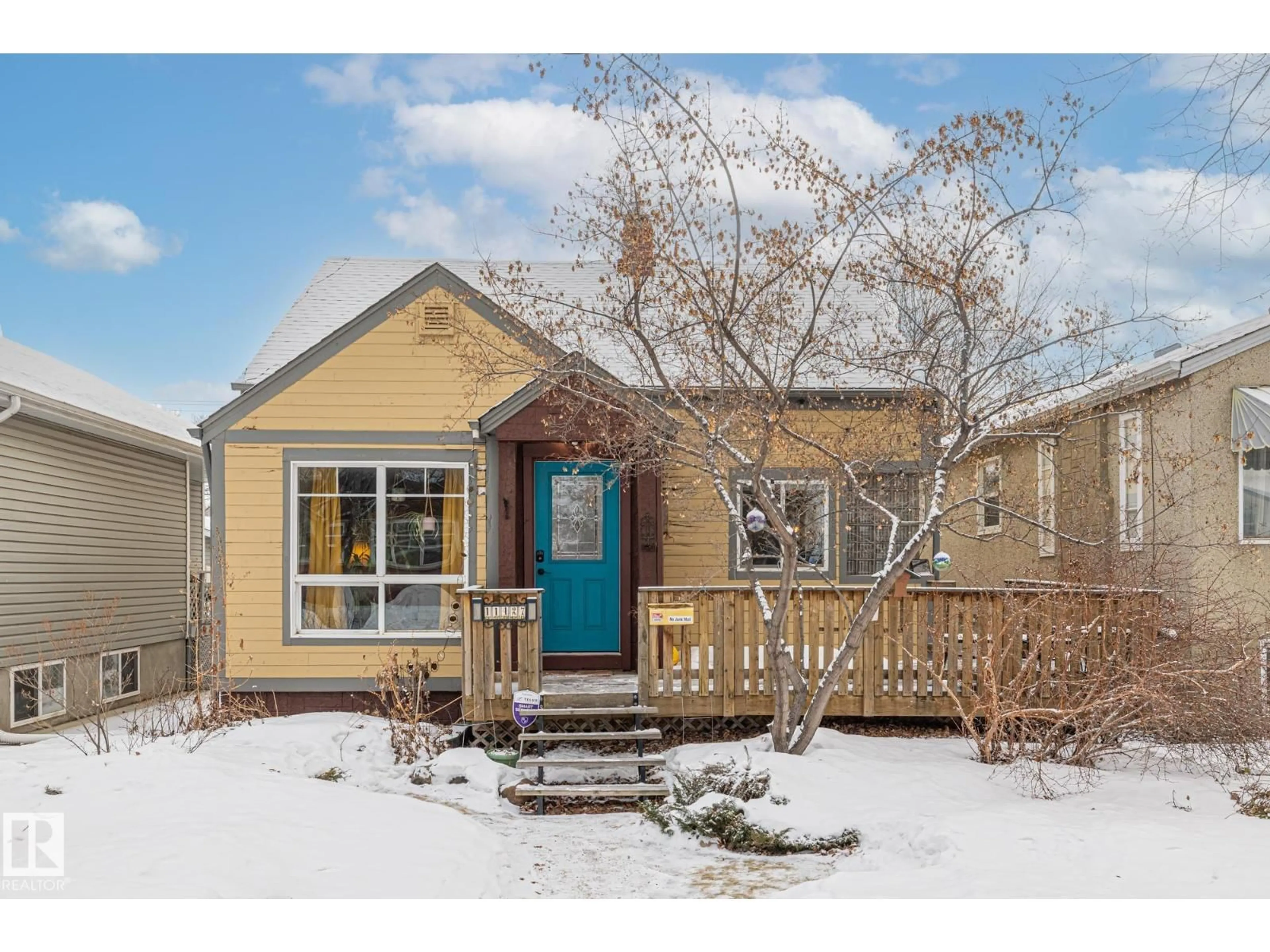 Home with vinyl exterior material, street for NW - 11427 68 ST, Edmonton Alberta T5B1N9