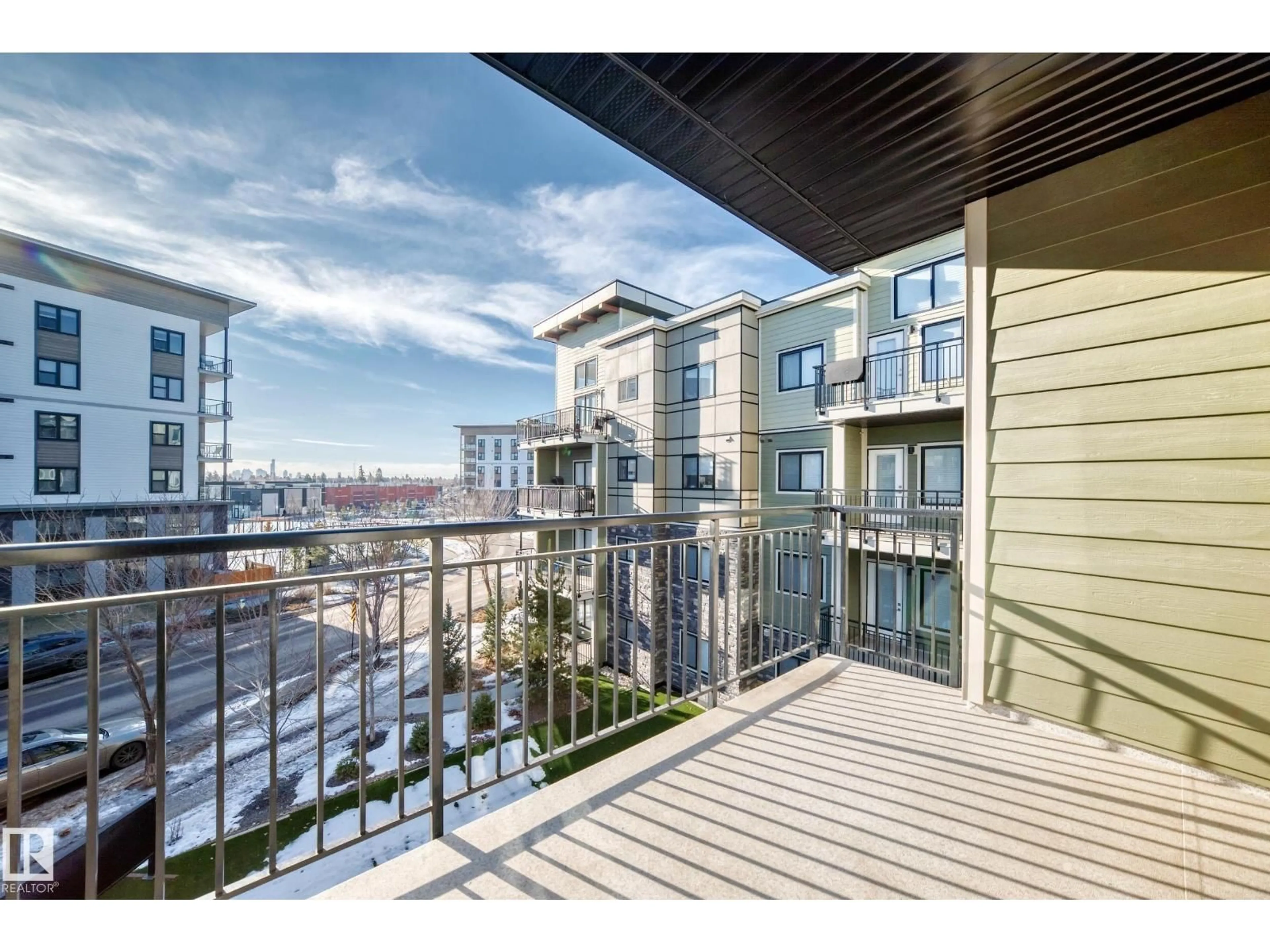 Patio, city buildings view from balcony for #322 - 560 GRIESBACH PARADE, Edmonton Alberta T5E6X1